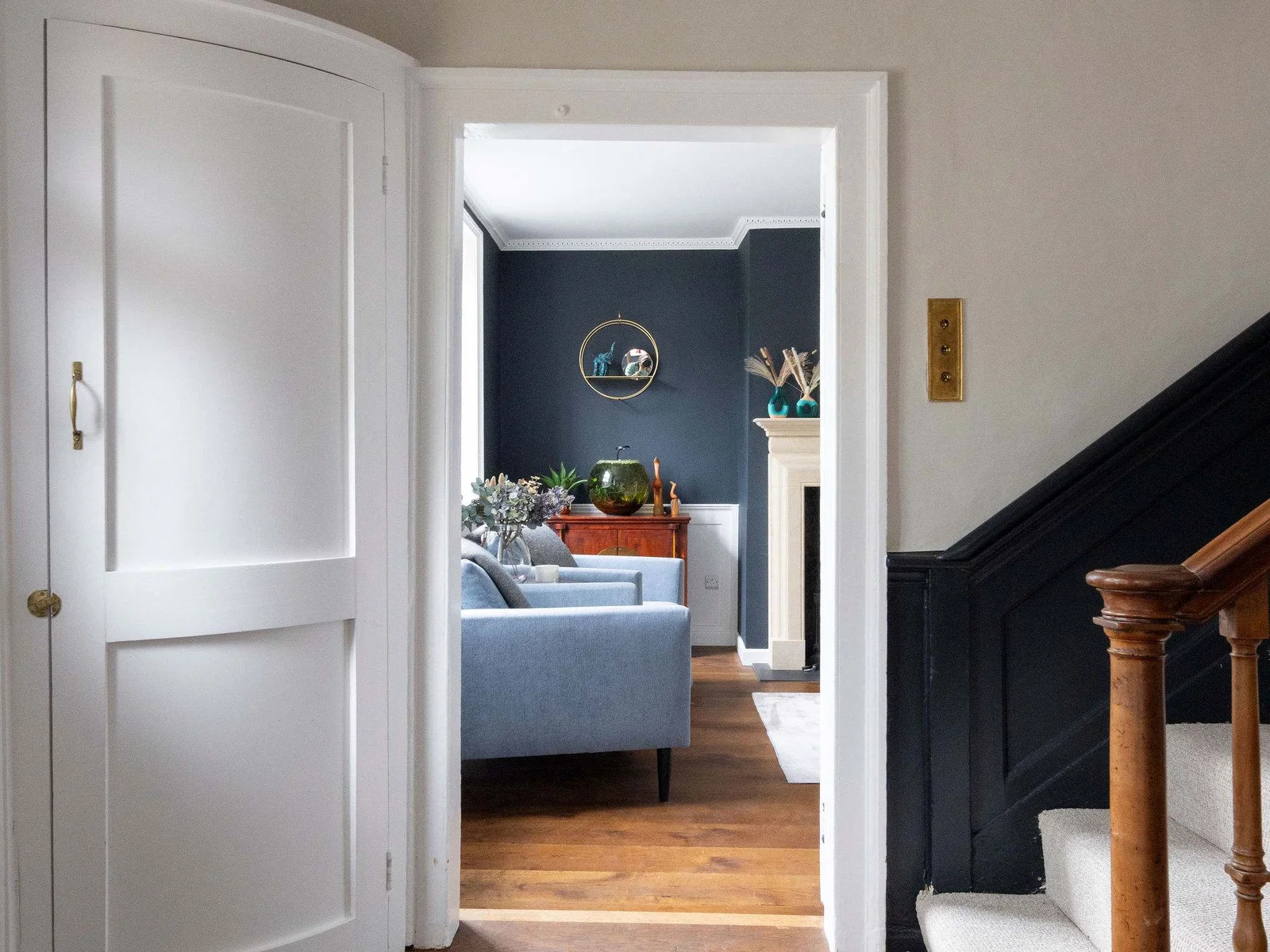 A stylish hallway leading into a warm, inviting lounge