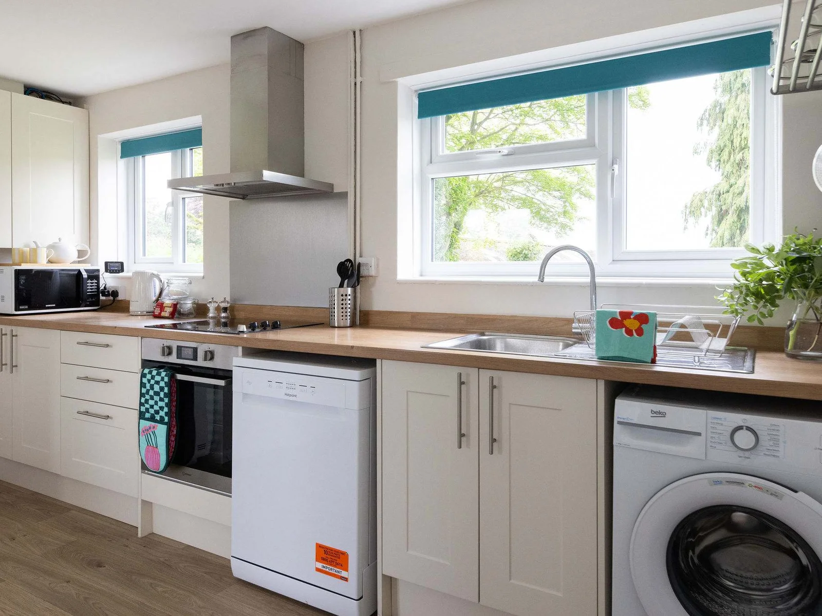 Stunning kitchen features beautiful cabinets and sleek appliances that make cooking a joy.