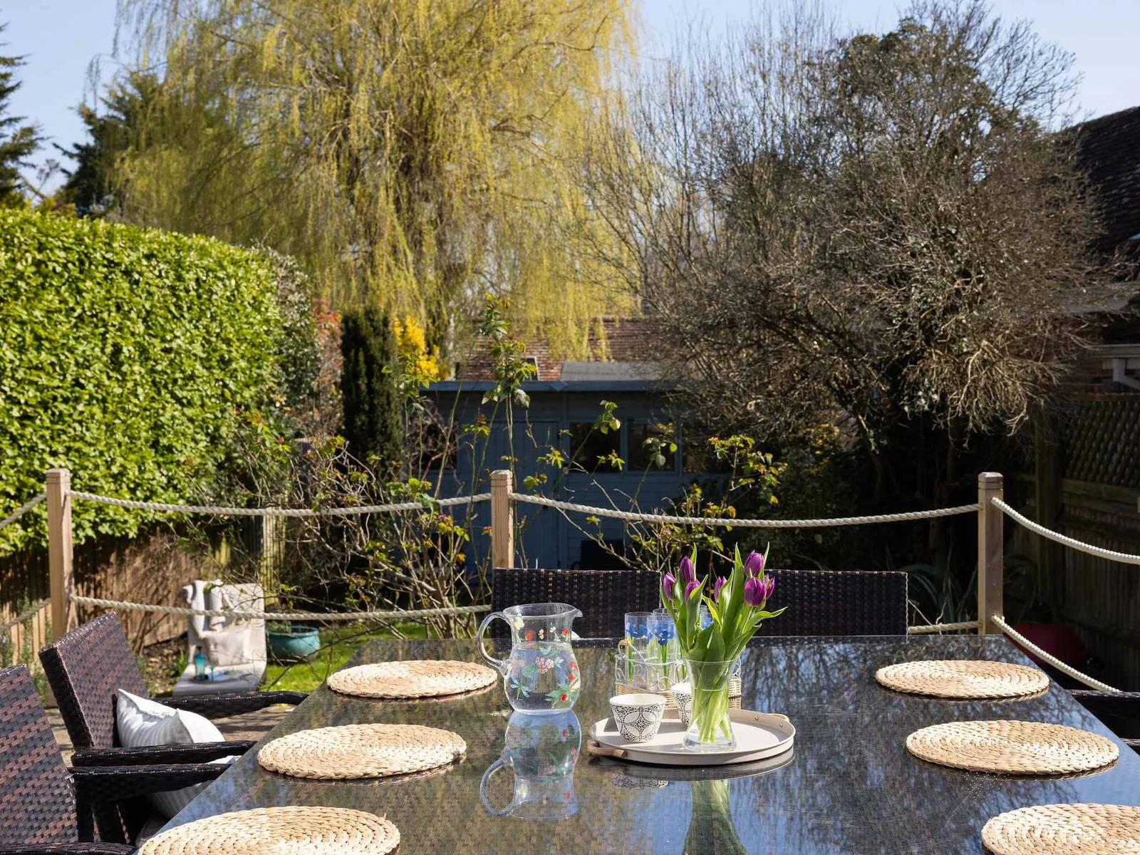 Sunny terrace perfect for al fresco dining with garden views