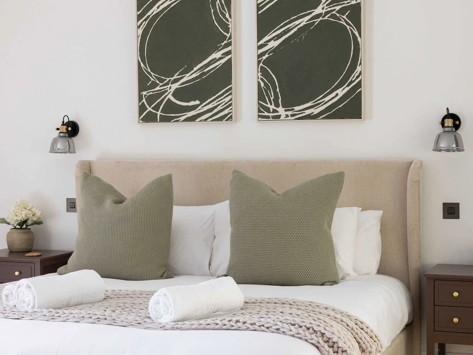Well-appointed bedroom with bedside tables and comfortable bedding