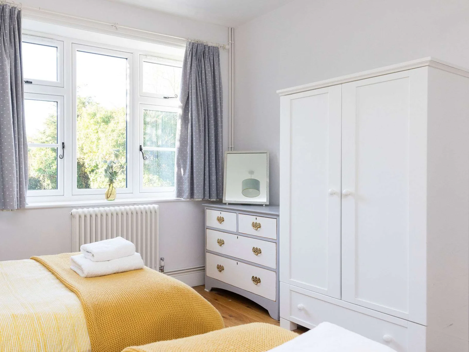 This twin bedroom has wardrobes and chest of drawers for your personal belongings.