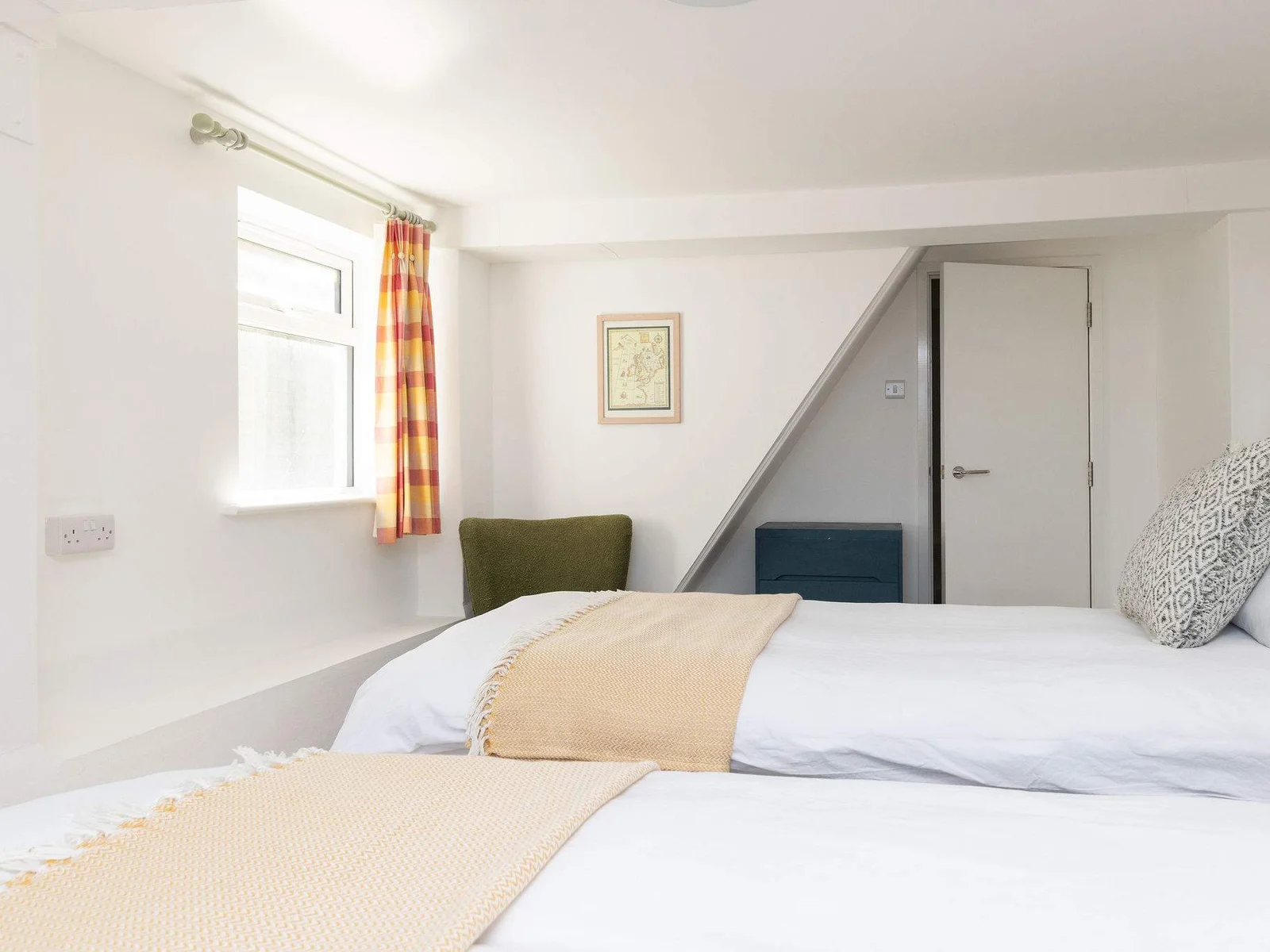 Light-filled room with quirky angles and charm