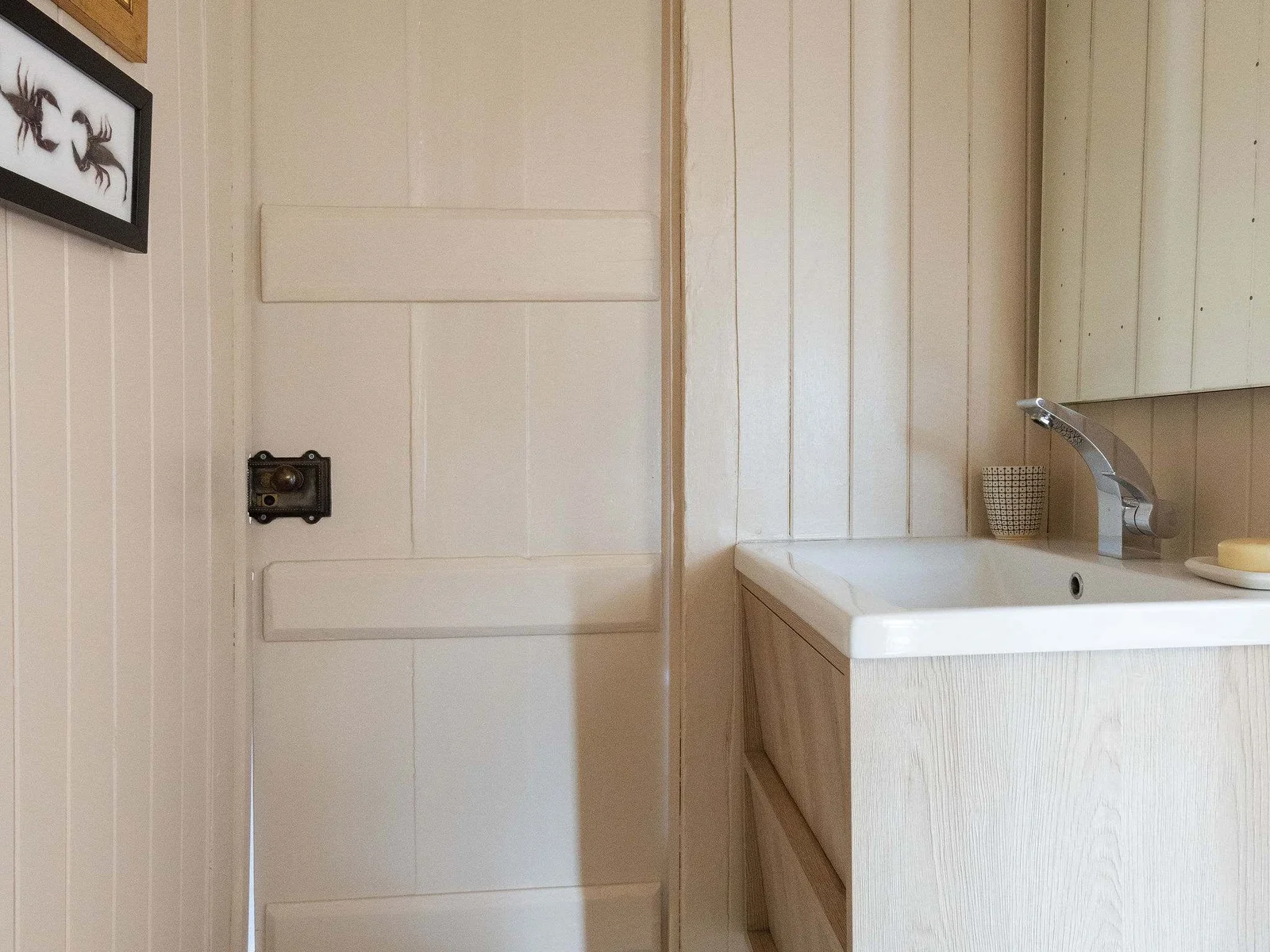 Modern jack and jill cloakroom with stylish vanity and sleek finish