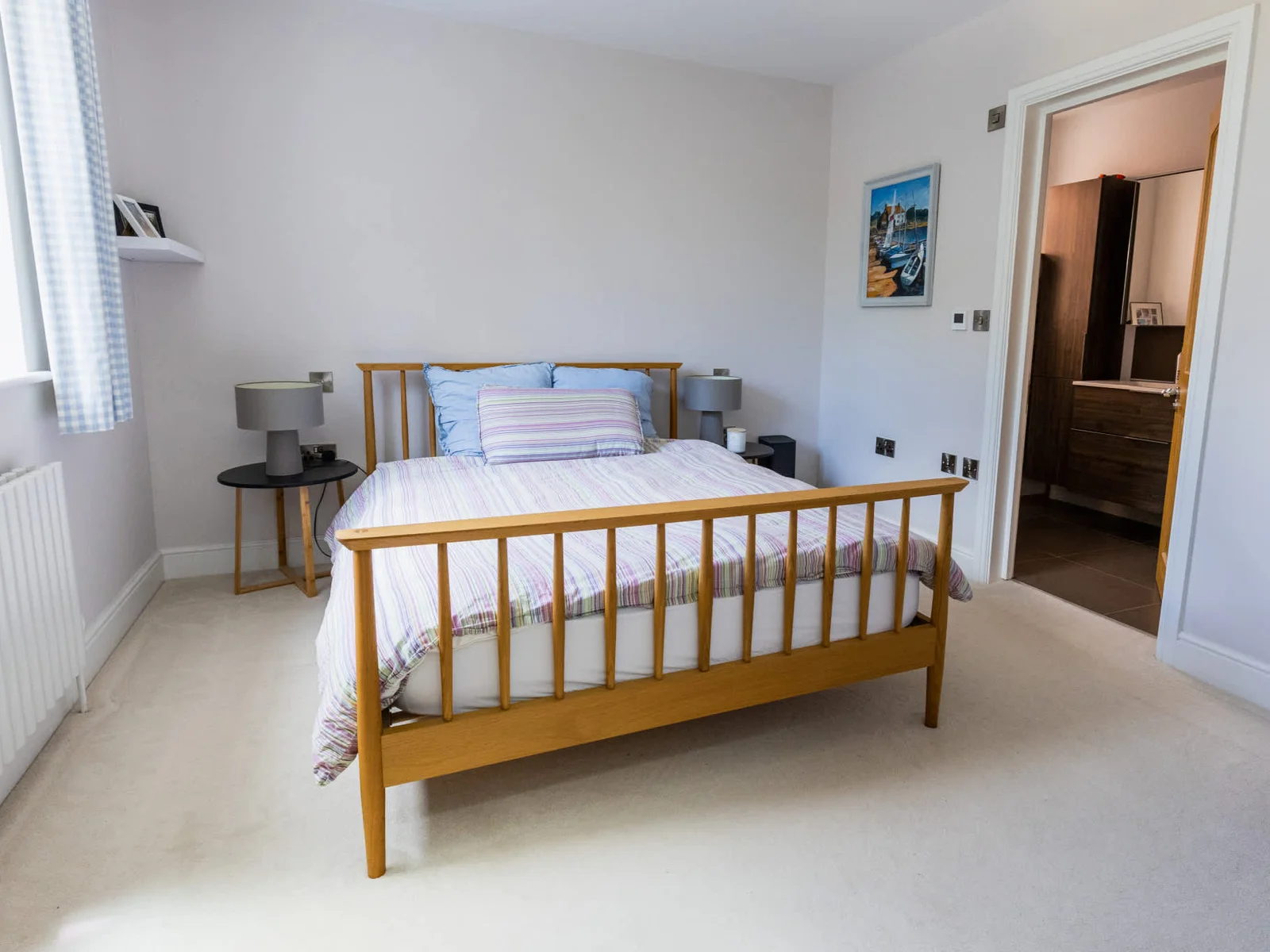 Bright double bedroom with garden views and comfortable bedding for a restful stay.