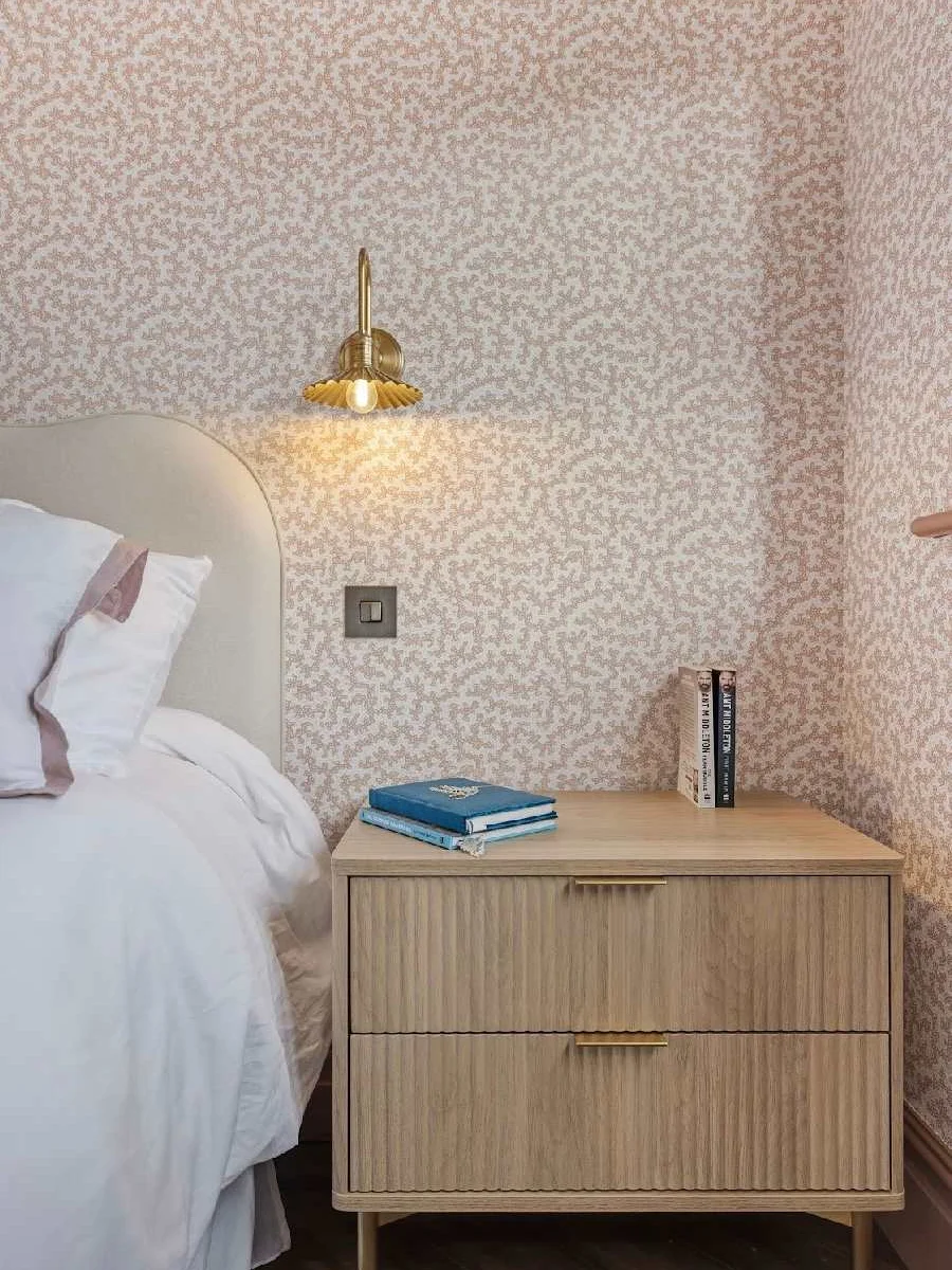 Elegant bedside details and soft lighting.