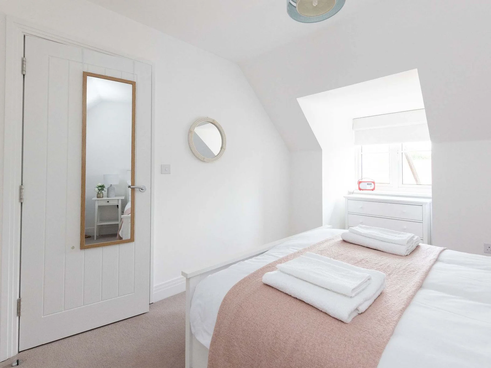 A bright and peaceful bedroom for your own quiet sanctuary.