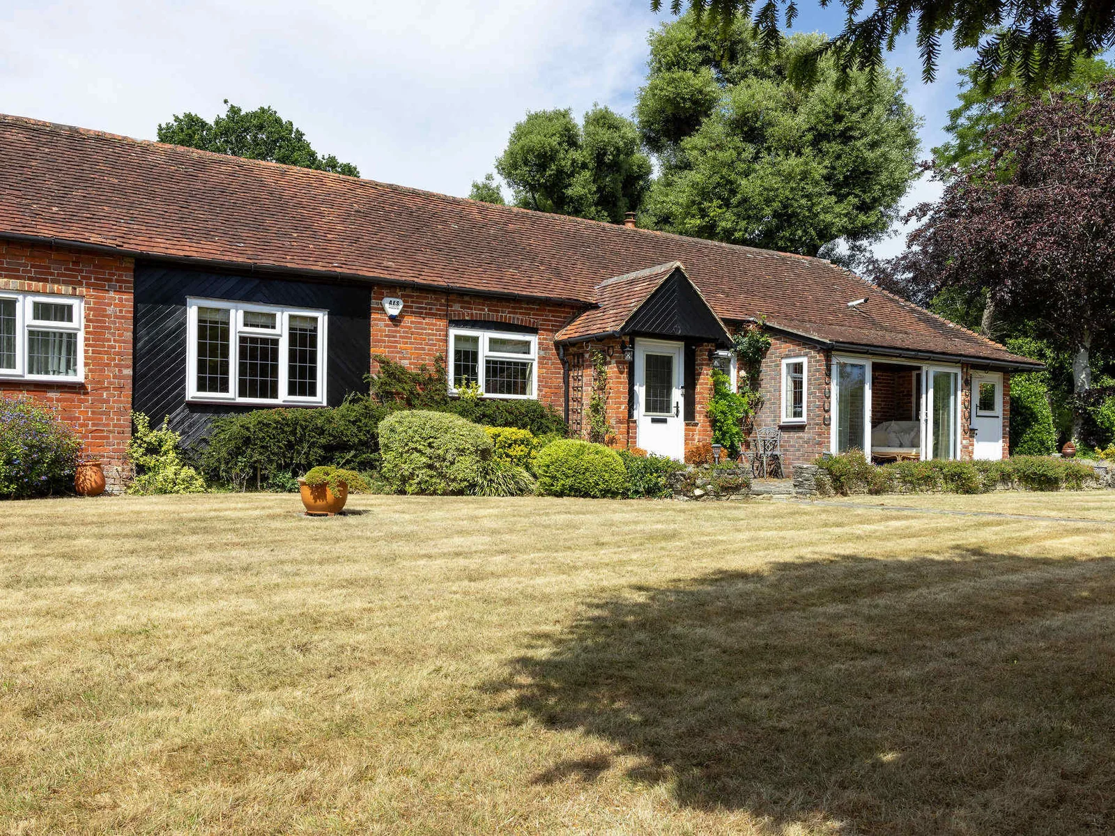 The cottage is surrounded by mature gardens and trees. Enjoy a peaceful, private outdoor space to relax, dine or play.