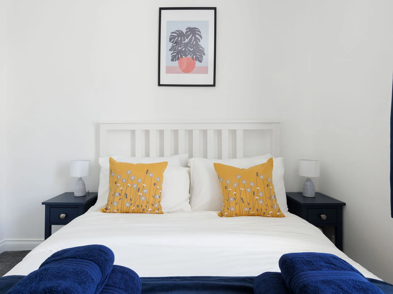 Retreat to the king bedroom, where cosy bedding and calming decor ensure a restful night's sleep.