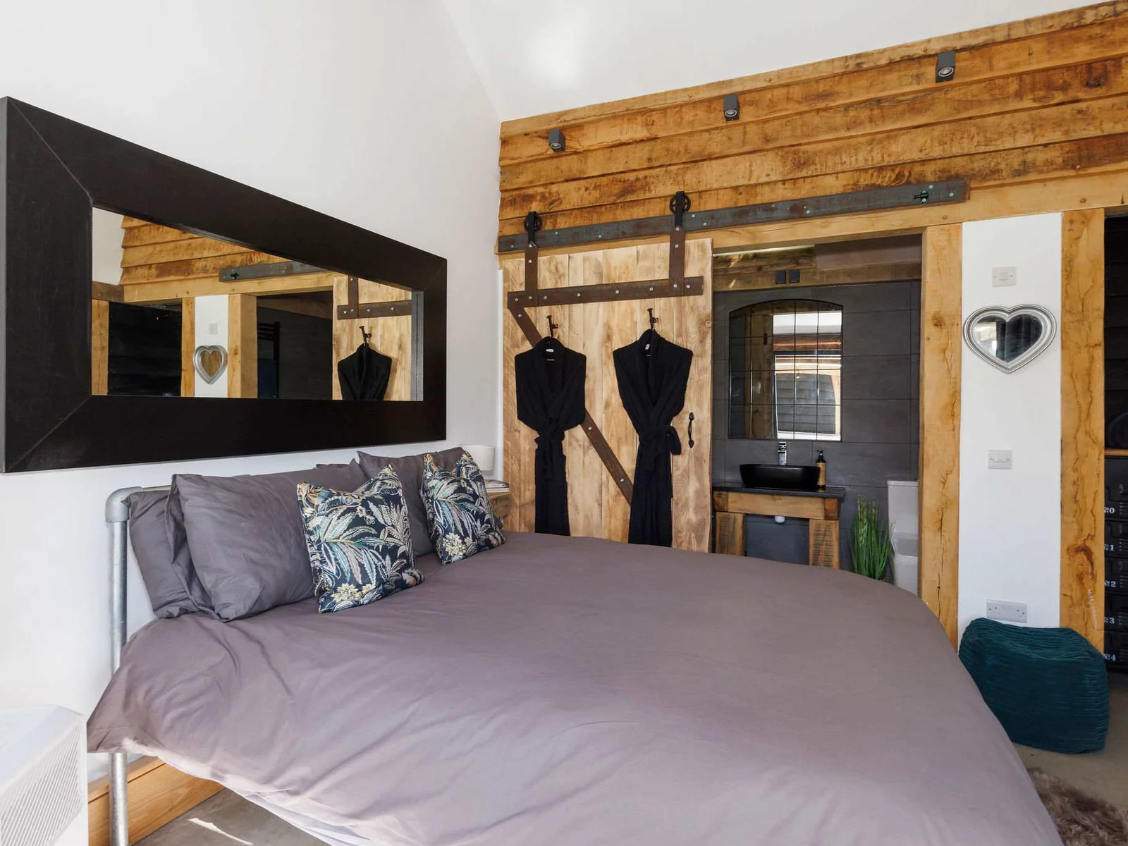 The double bedroom has comfy quality linen and cushions for a good nights rest.