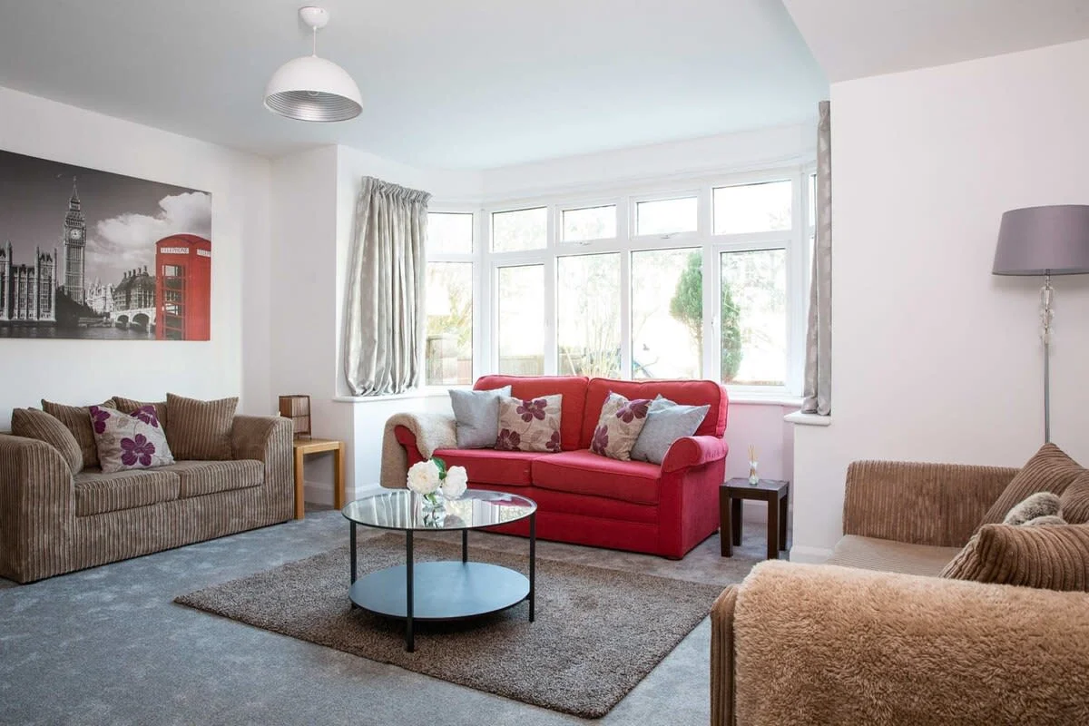 There are 2 sofas in the living room. One converts into a bed for extra sleeping space.