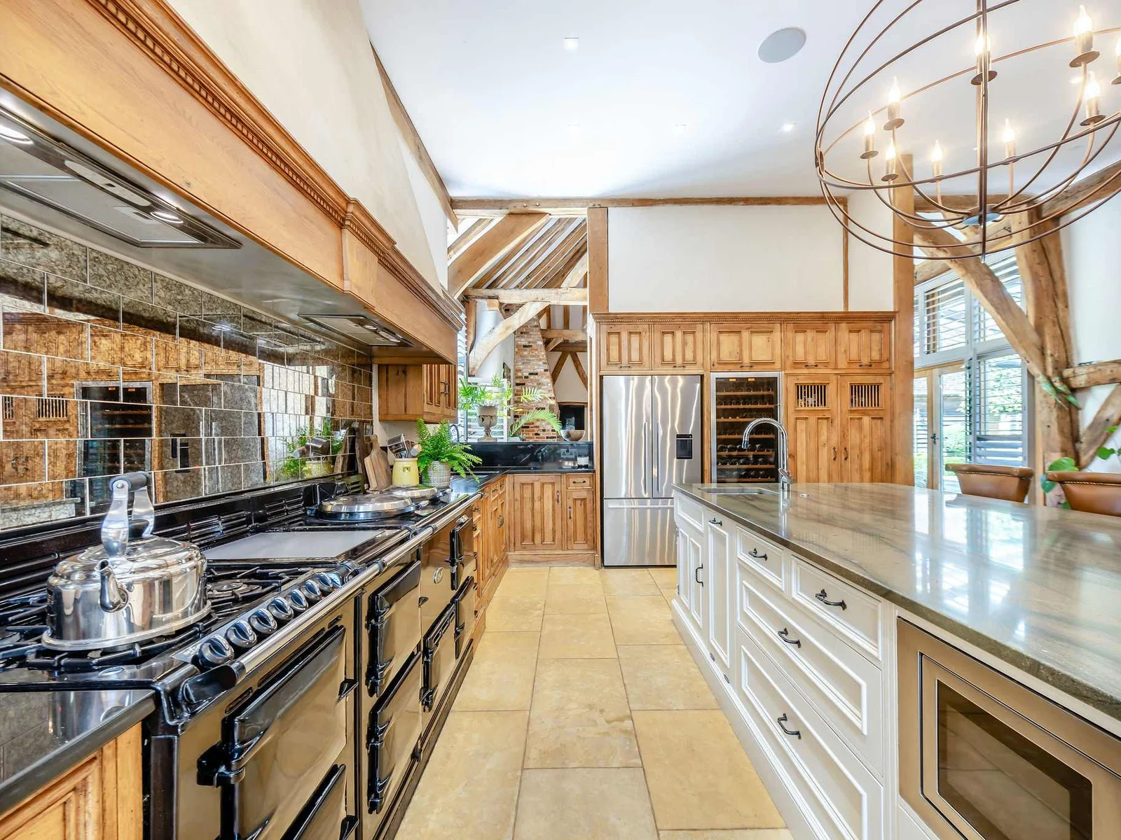 Cook and gather around the large kitchen island, with a traditional 6 oven aga at the heart of the room.