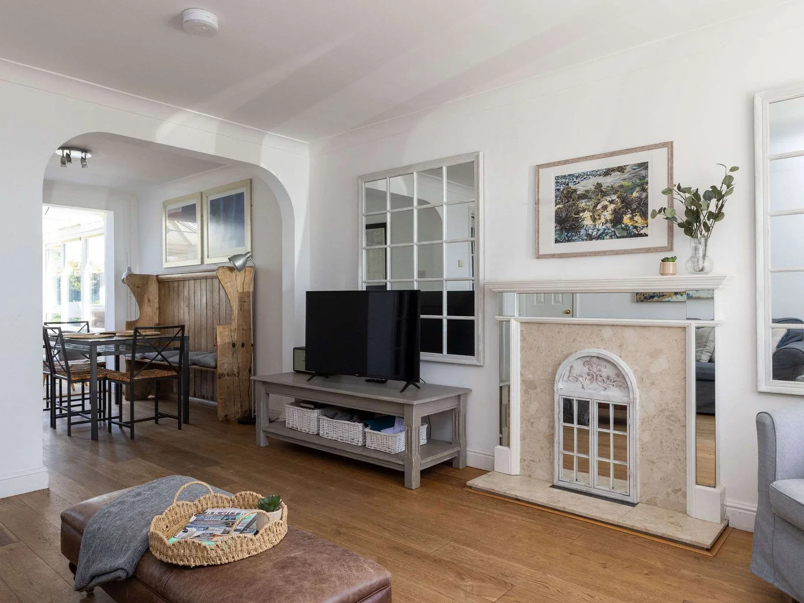 Spacious living area with stylish décor, ideal for relaxing after seaside adventures together.