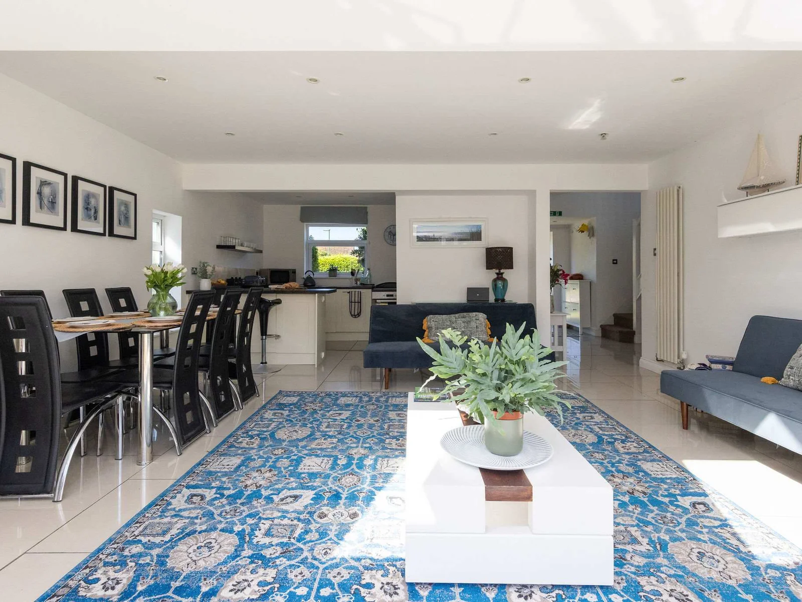 Gather for meals in the spacious open plan living area of this family getaway.
