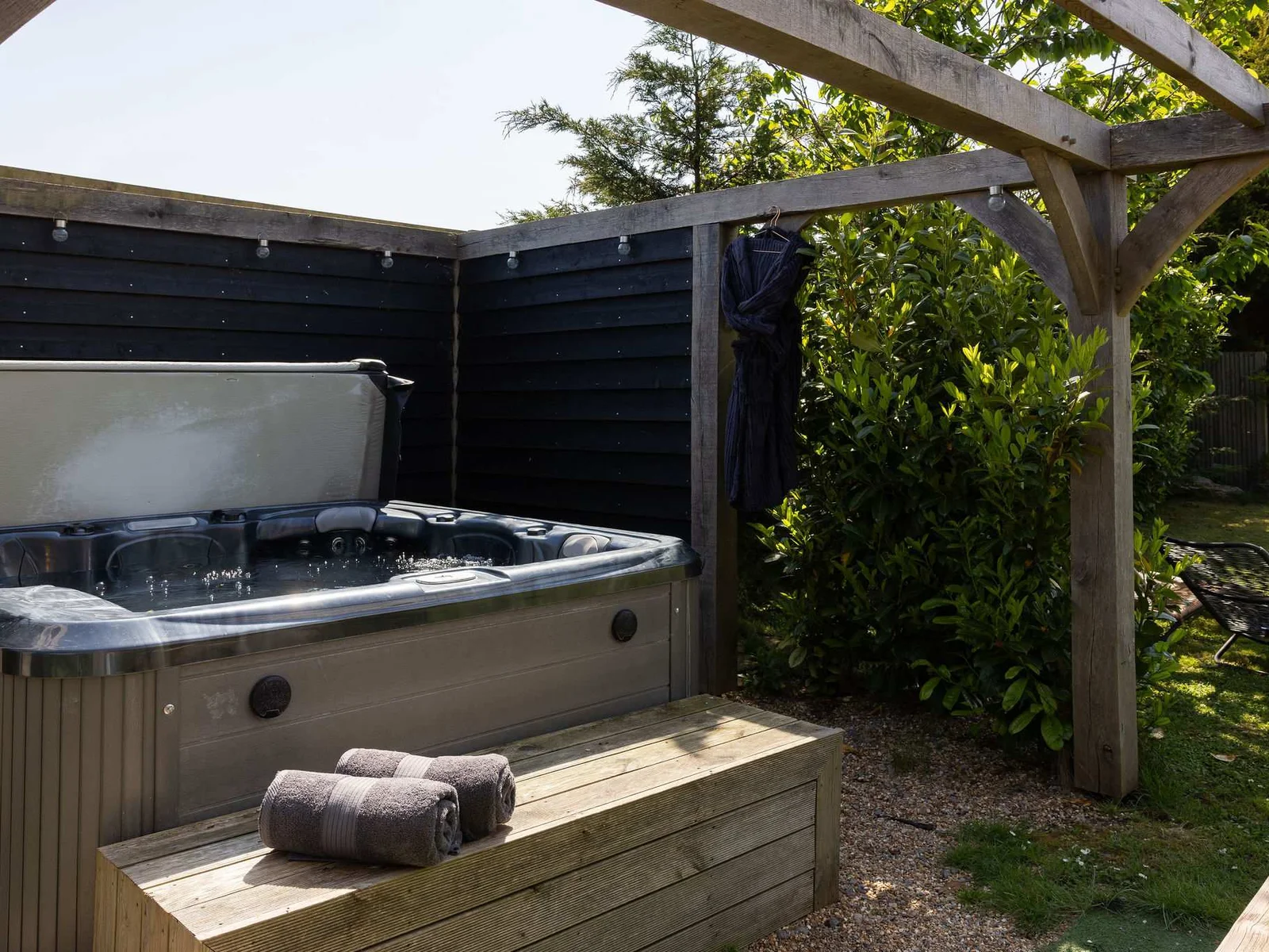 Step outside into your private courtyard and unwind in the luxurious outdoor hot tub.