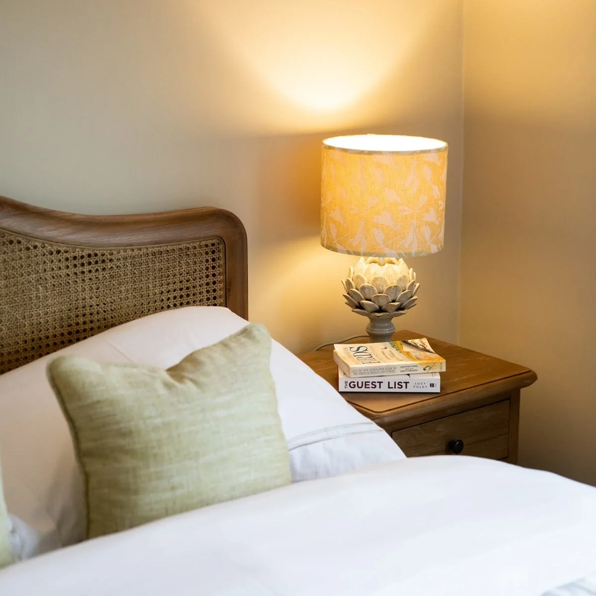 The rooms have bedside tables and reading lamps.