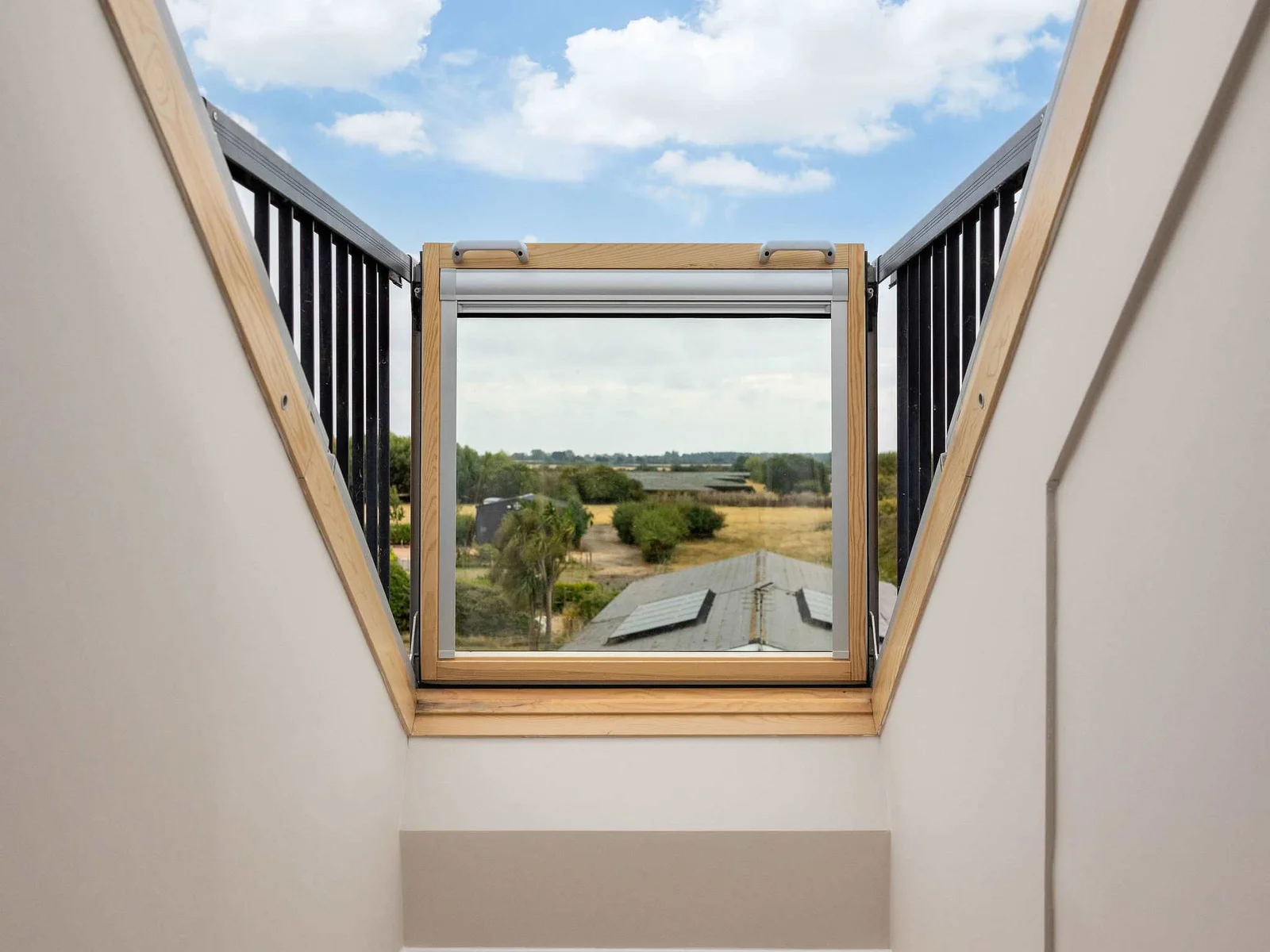 Positioned on the landing between the two top-floor bedrooms, the skylight draws in beautiful natural light and looks out across the surrounding countryside.
