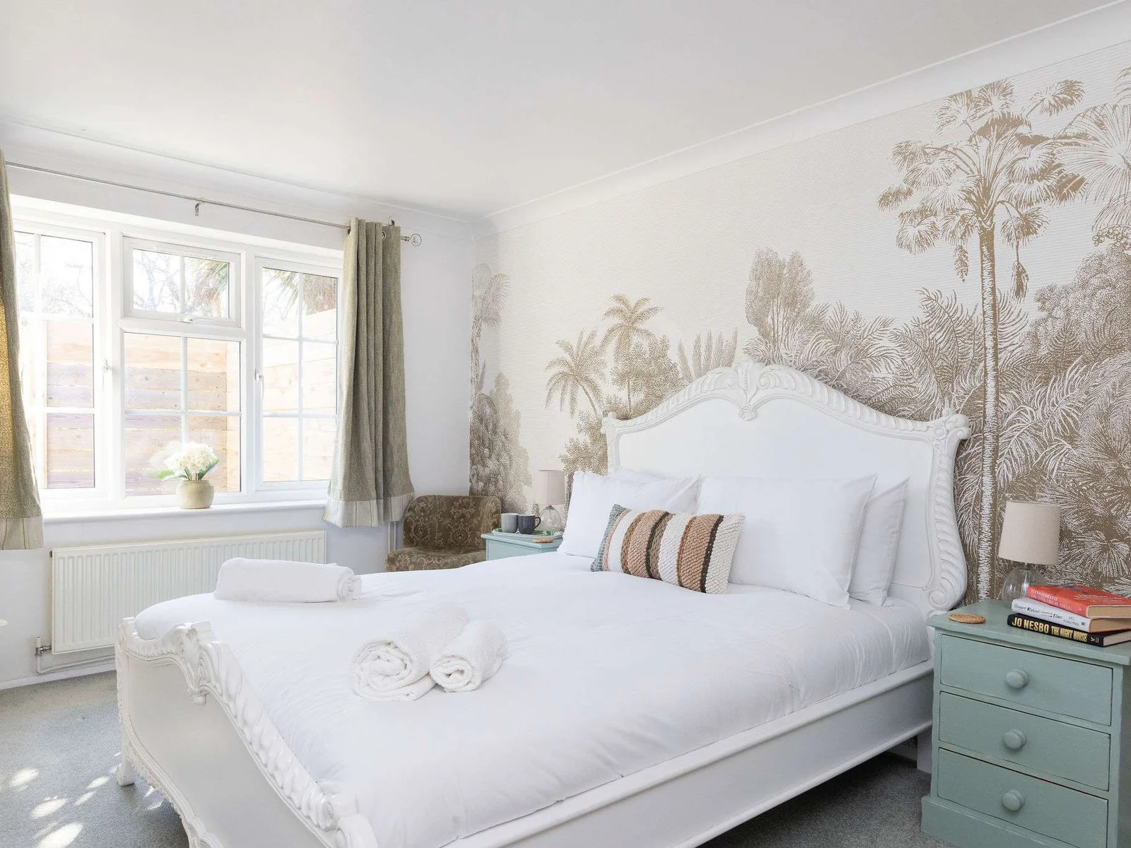 Peaceful king bedroom with elegant design, quality linens and a calm retreat for restful coastal stays.