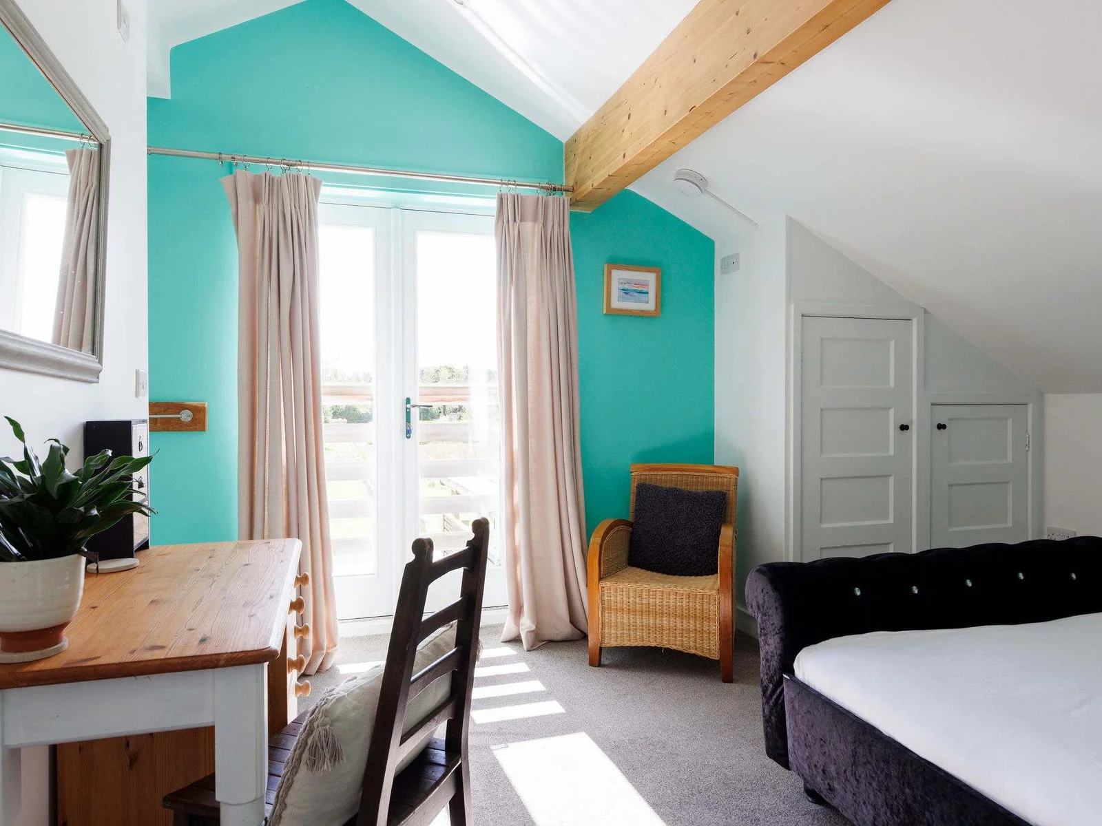 The master room is spacious and lets plenty of natural light in.