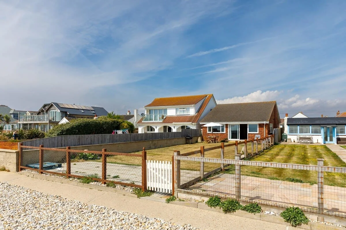 The back garden leads directly onto East Wittering's pebble beach.