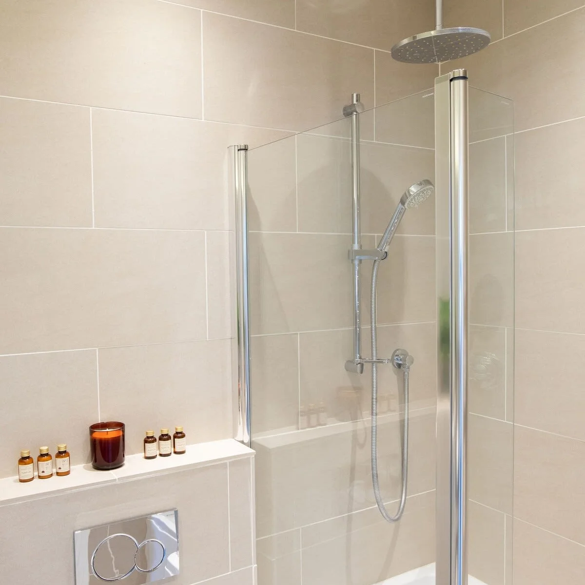 Rainfall shower over full sized bath.