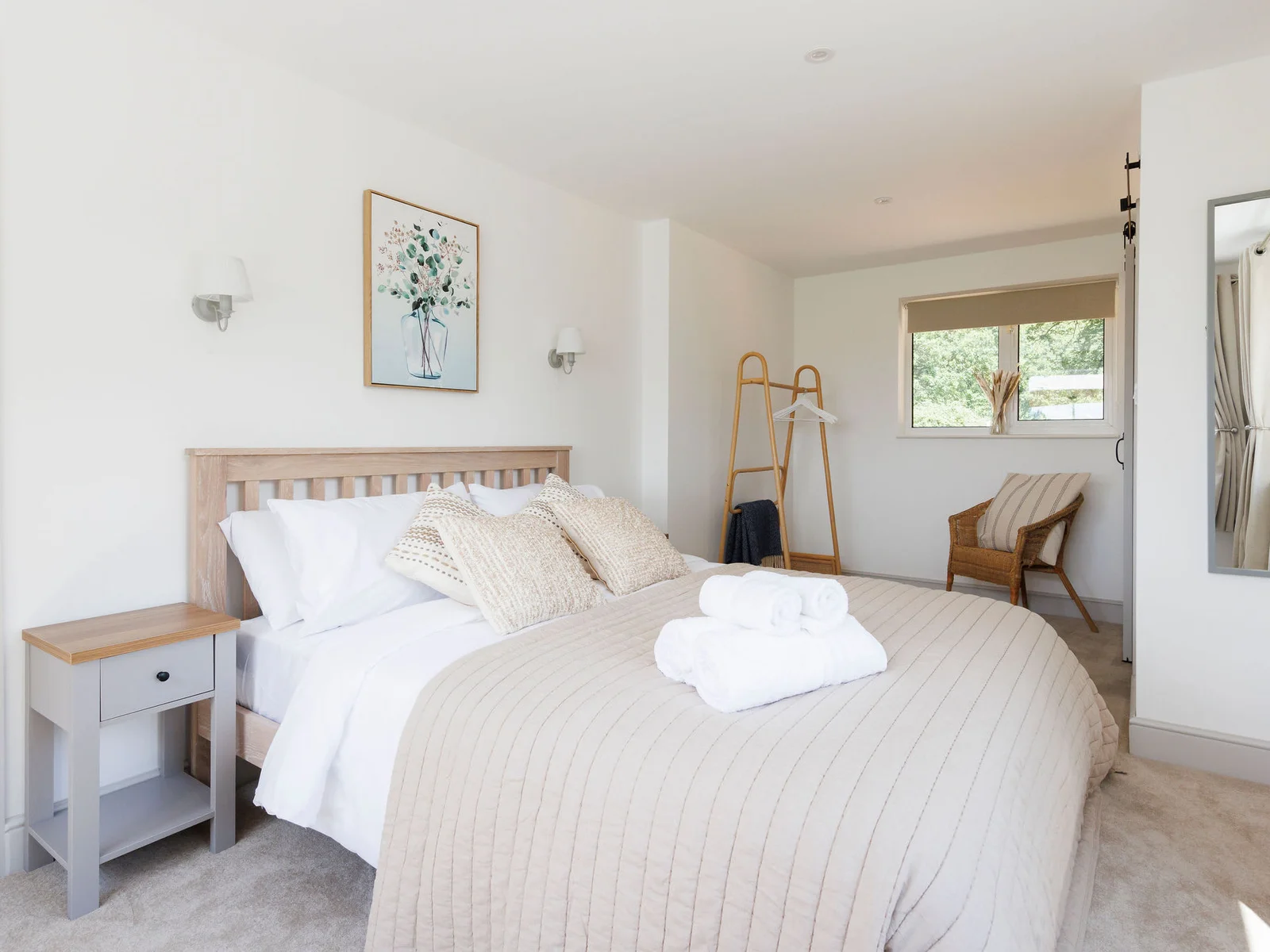 Spacious master bedroom with neutral tones and plenty of natural light.