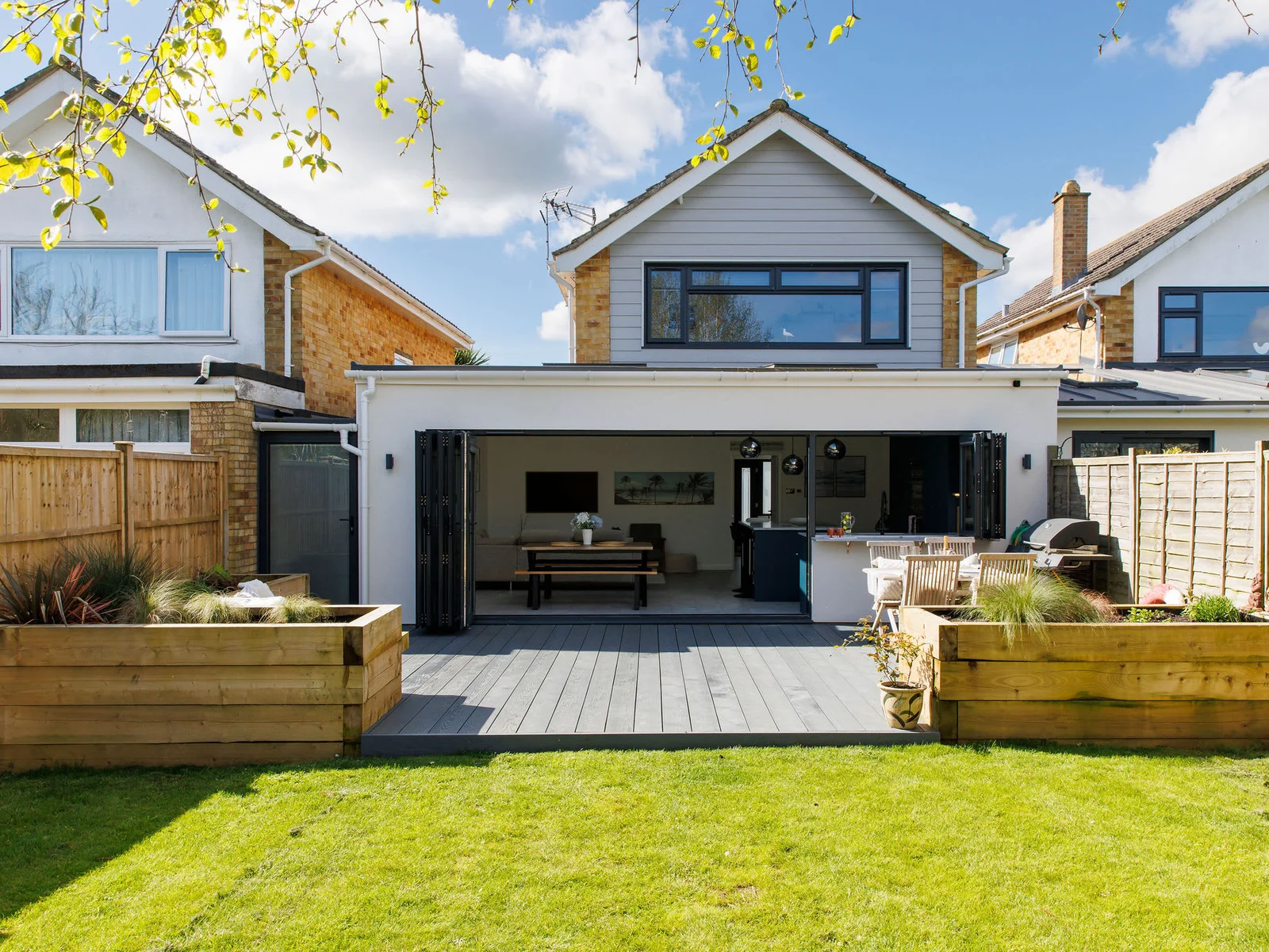 The garden has raised beds, a manicured lawn and a beautiful decked area for dining and relaxing.