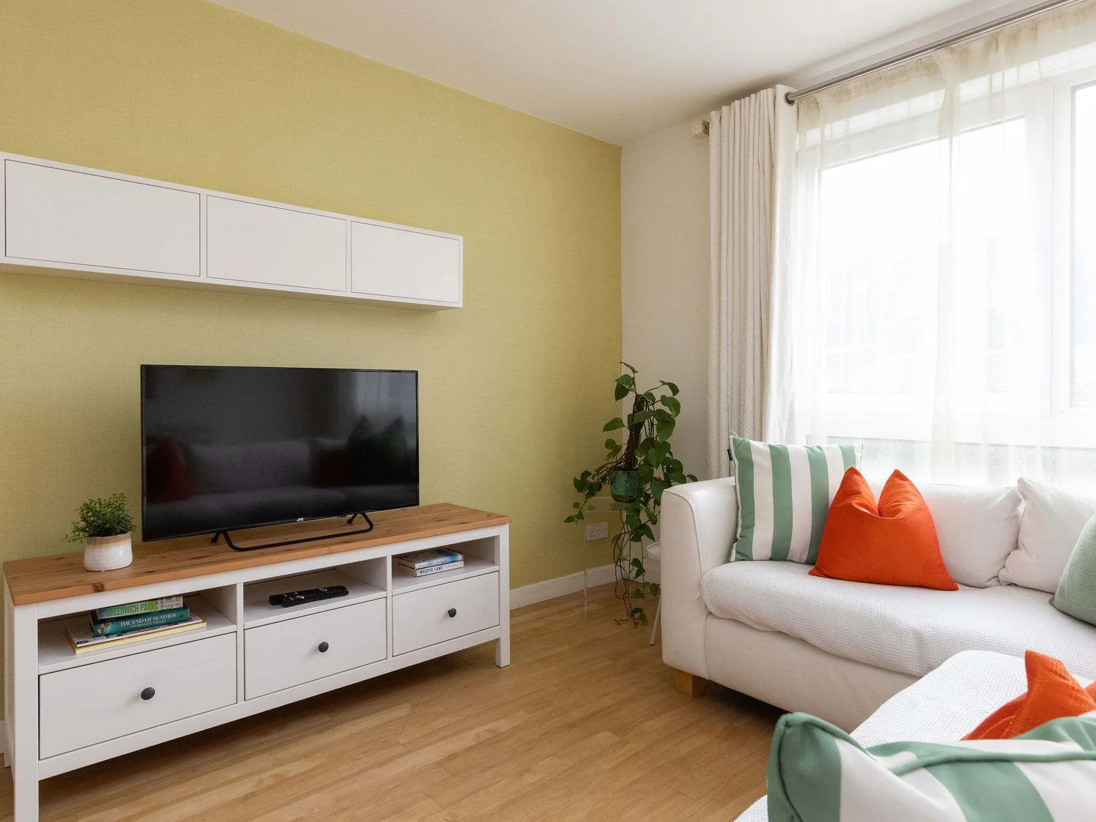 Comfortable living space with Smart TV and cosy seating, ideal for relaxing evenings in.