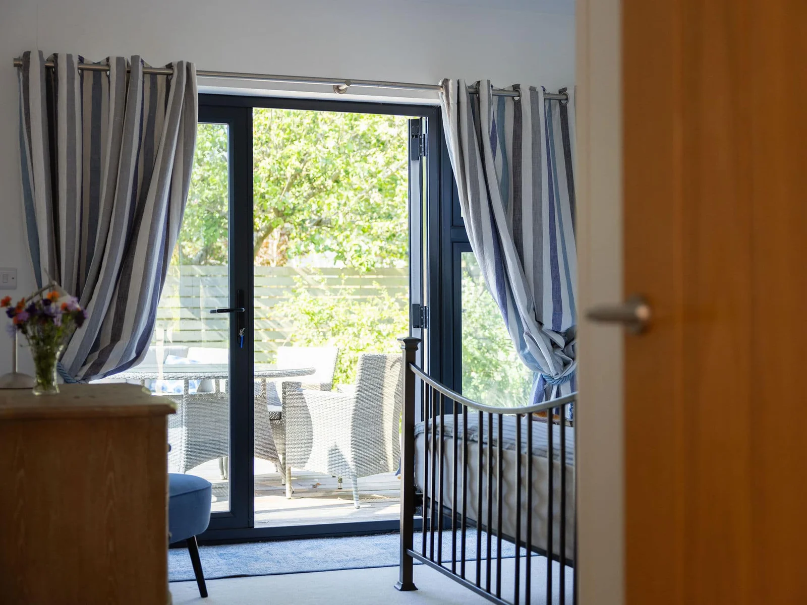 The master bedroom offers a peaceful escape with patio doors leading to a lovely outdoor space.