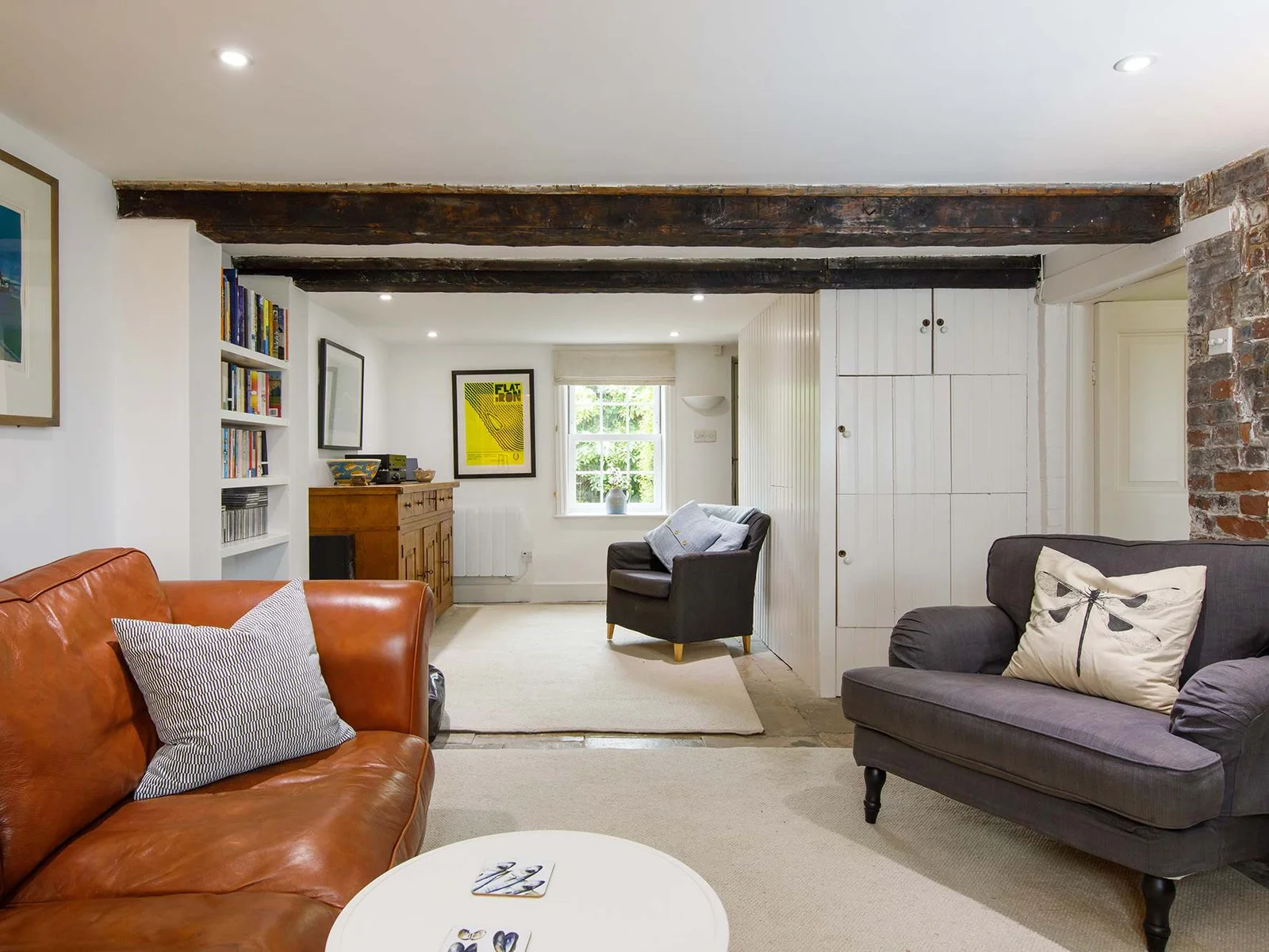 Bright ambiance complements the modern décor under the rustic exposed wooden beams
