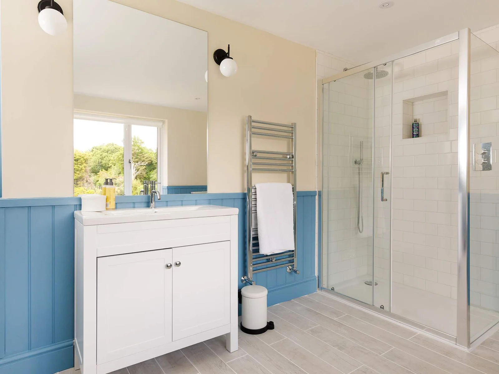 The vanity cabinet, with sink and mirror, is a great space to get ready in the morning or before heading to the pub in the evening.