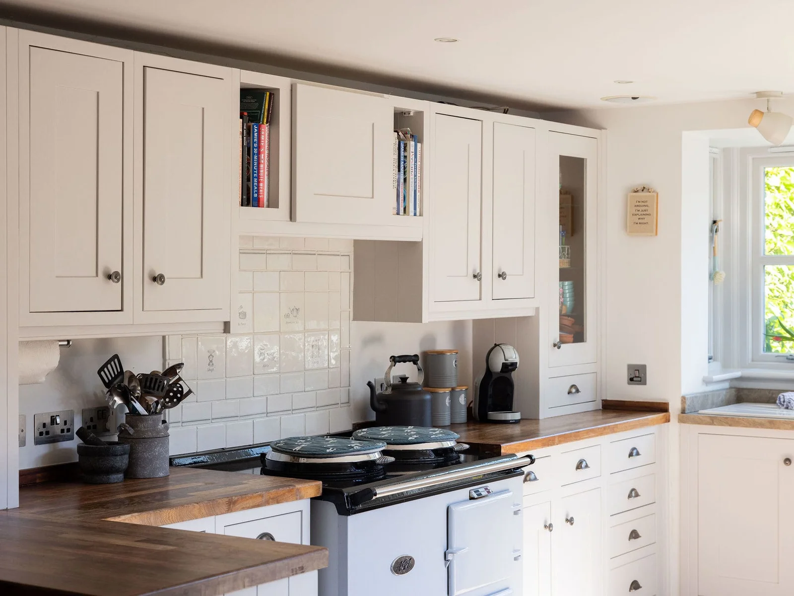 Beautiful country kitchen with range cooker and handcrafted cabinetry
