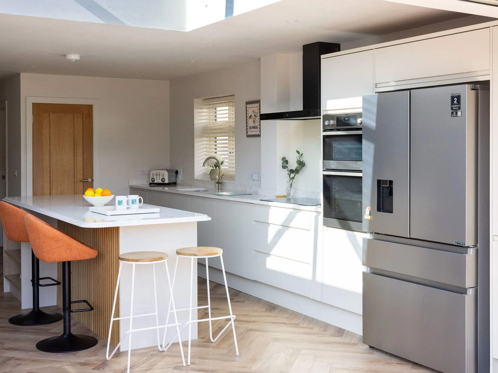 Contemporary coastal home with a fully equipped kitchen and spacious layout for relaxed family living.
