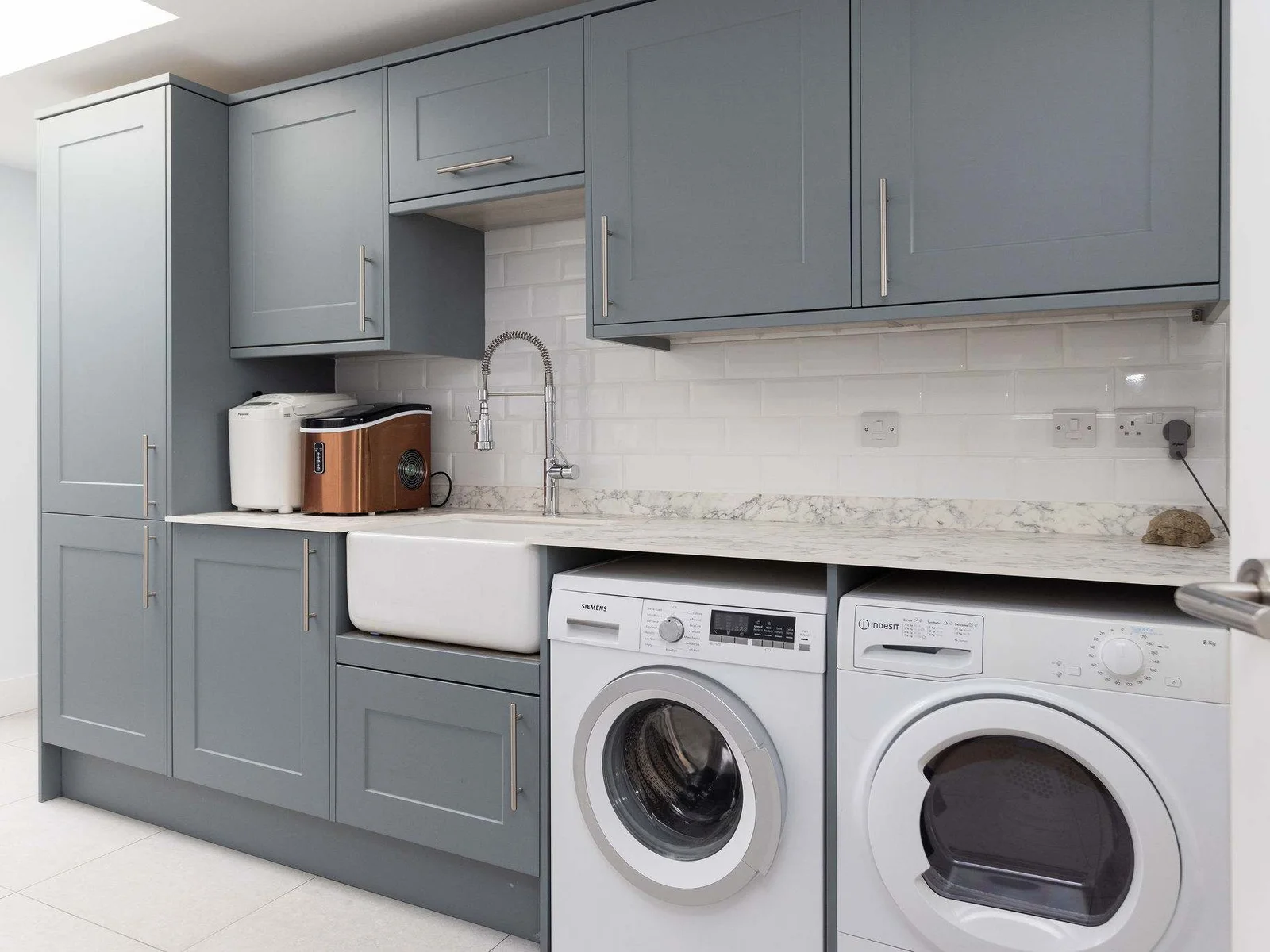 Practical touches for effortless longer stays in the fully equipped utility