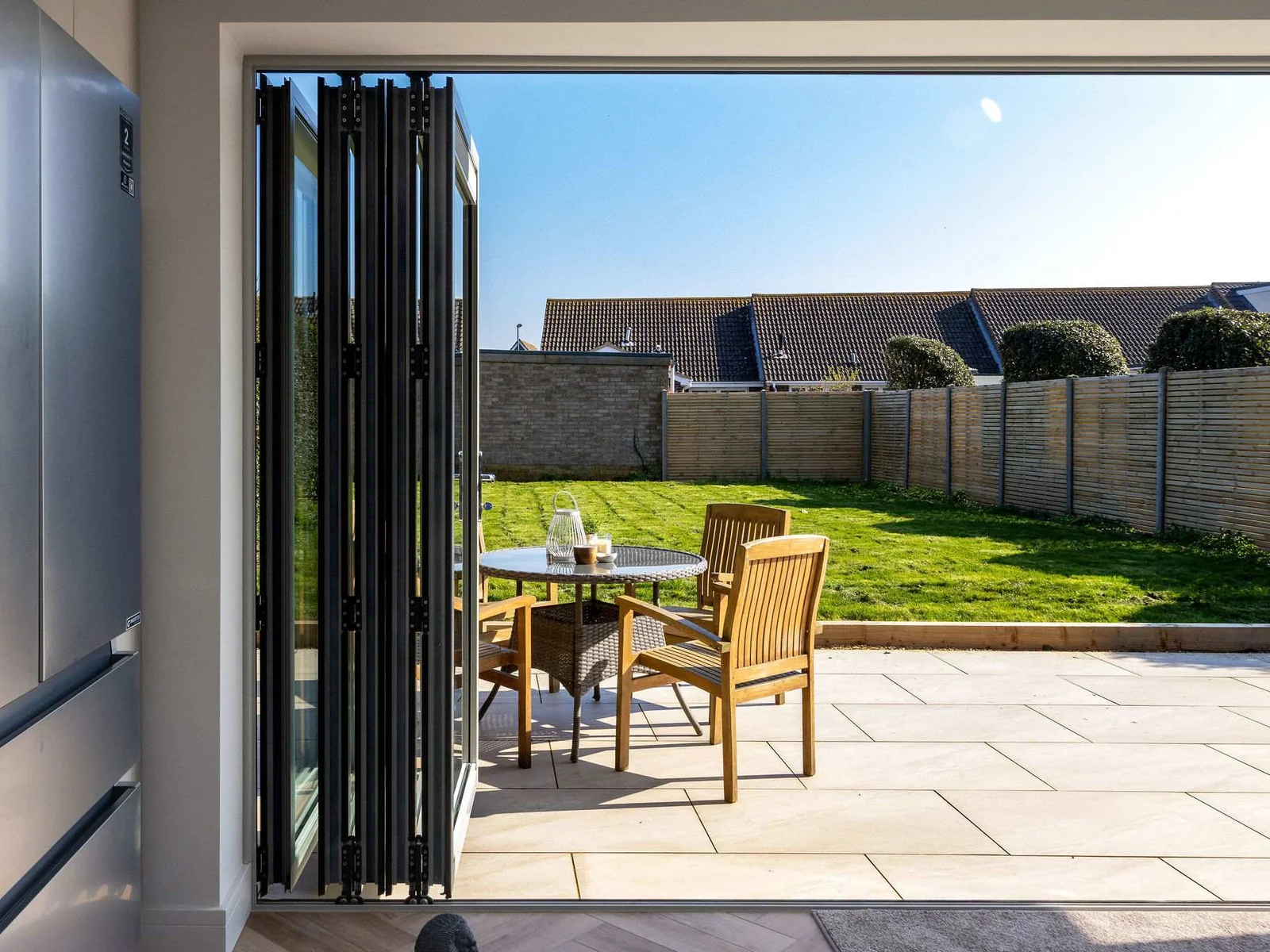 Modern coastal home with private garden, perfect for relaxing and enjoying outdoor living by the sea.