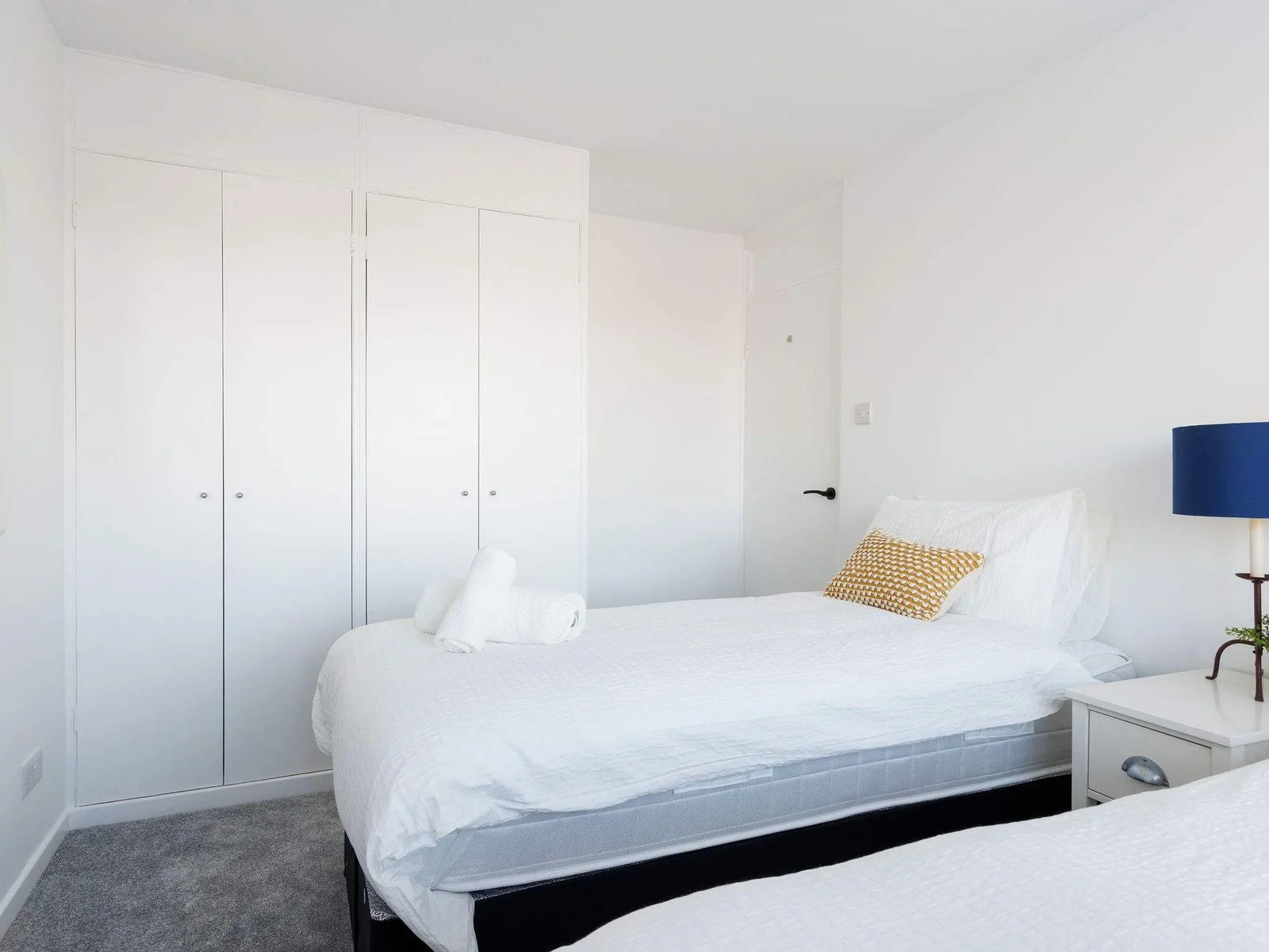 Bright twin room with plenty of storage