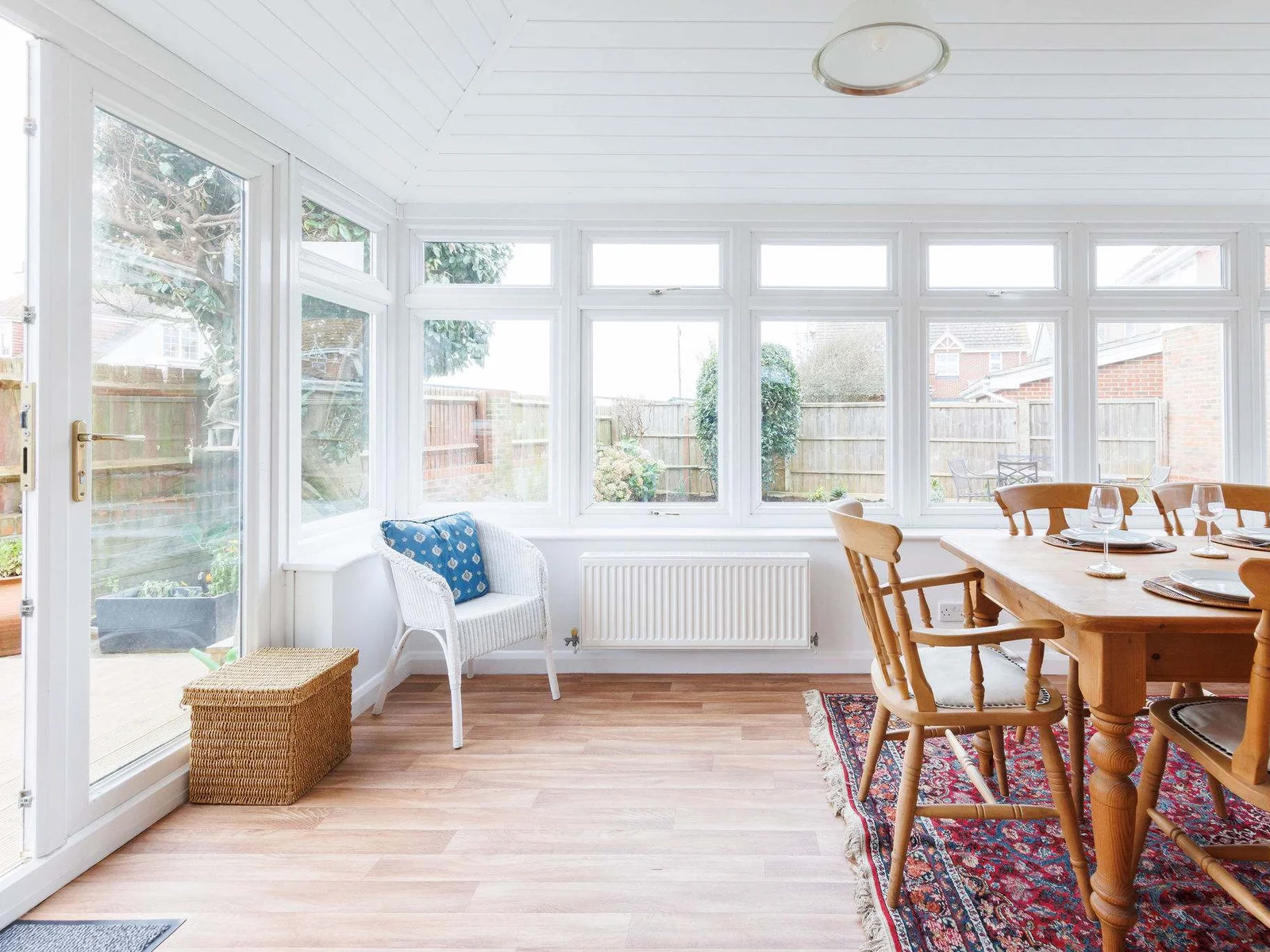 The conservatory is light and spacious. On warmer days, open the doors and enjoy the sea breeze over breakfast or lunch.