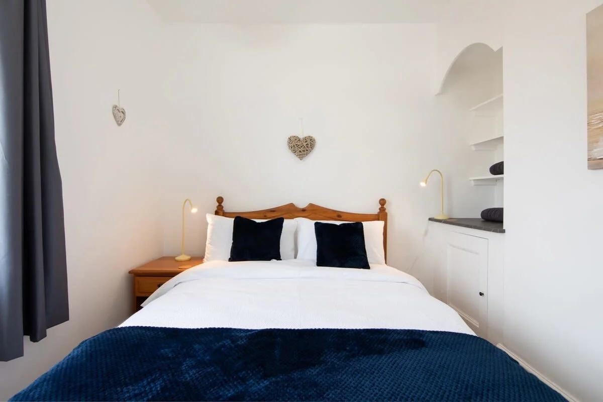 Bedroom one with a comfortable double bed