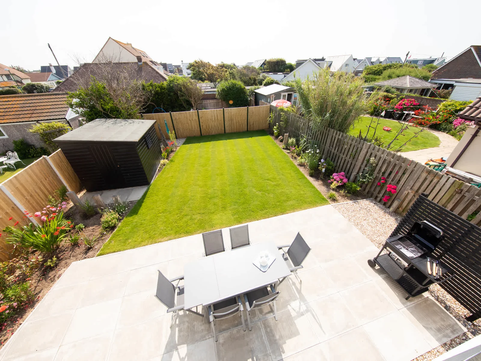 The Juliet balcony of the master bedroom overlooks the colourful garden