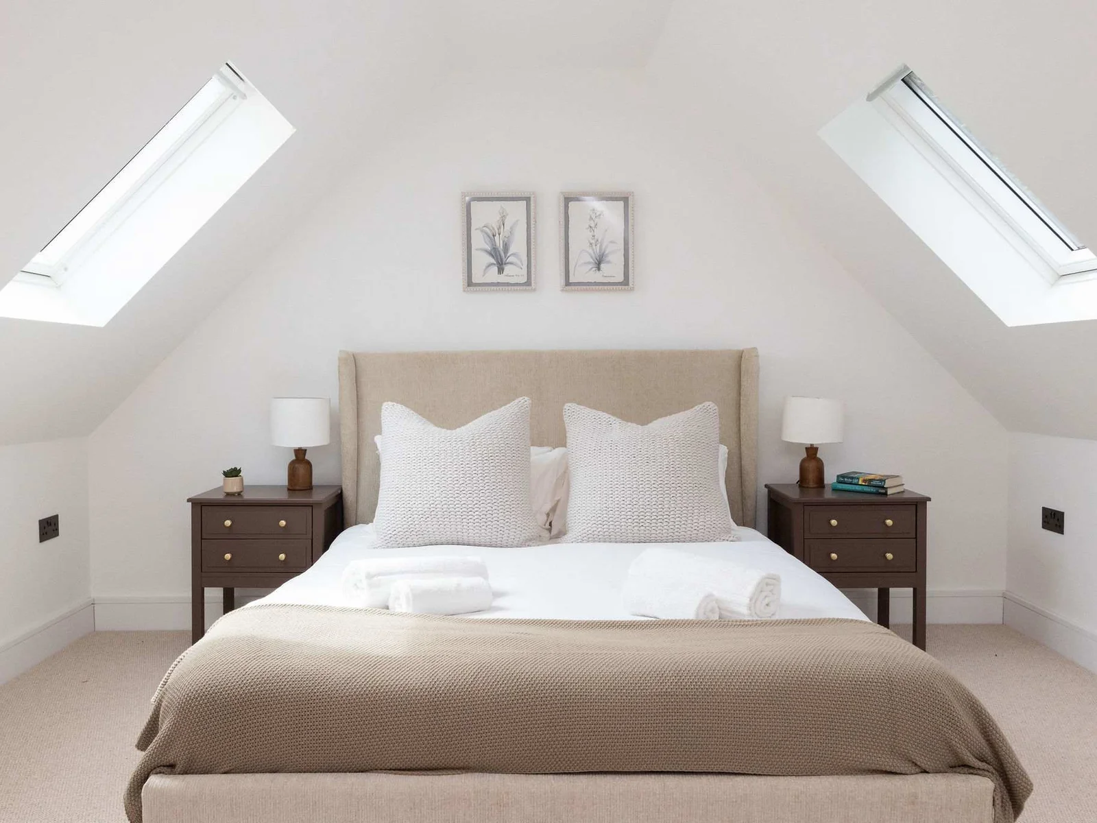 Bright bedroom with skylights and elegant furnishings