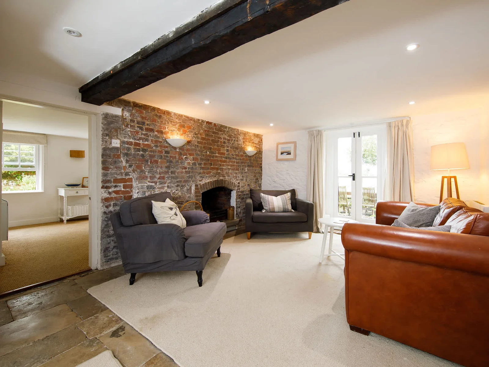 Wonderful lounge area surrounds the intimate brick fireplace