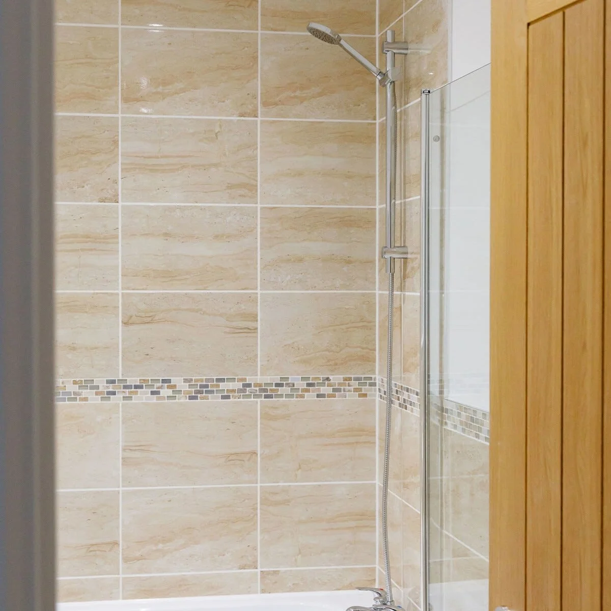 The family bathroom has an overhead shower.