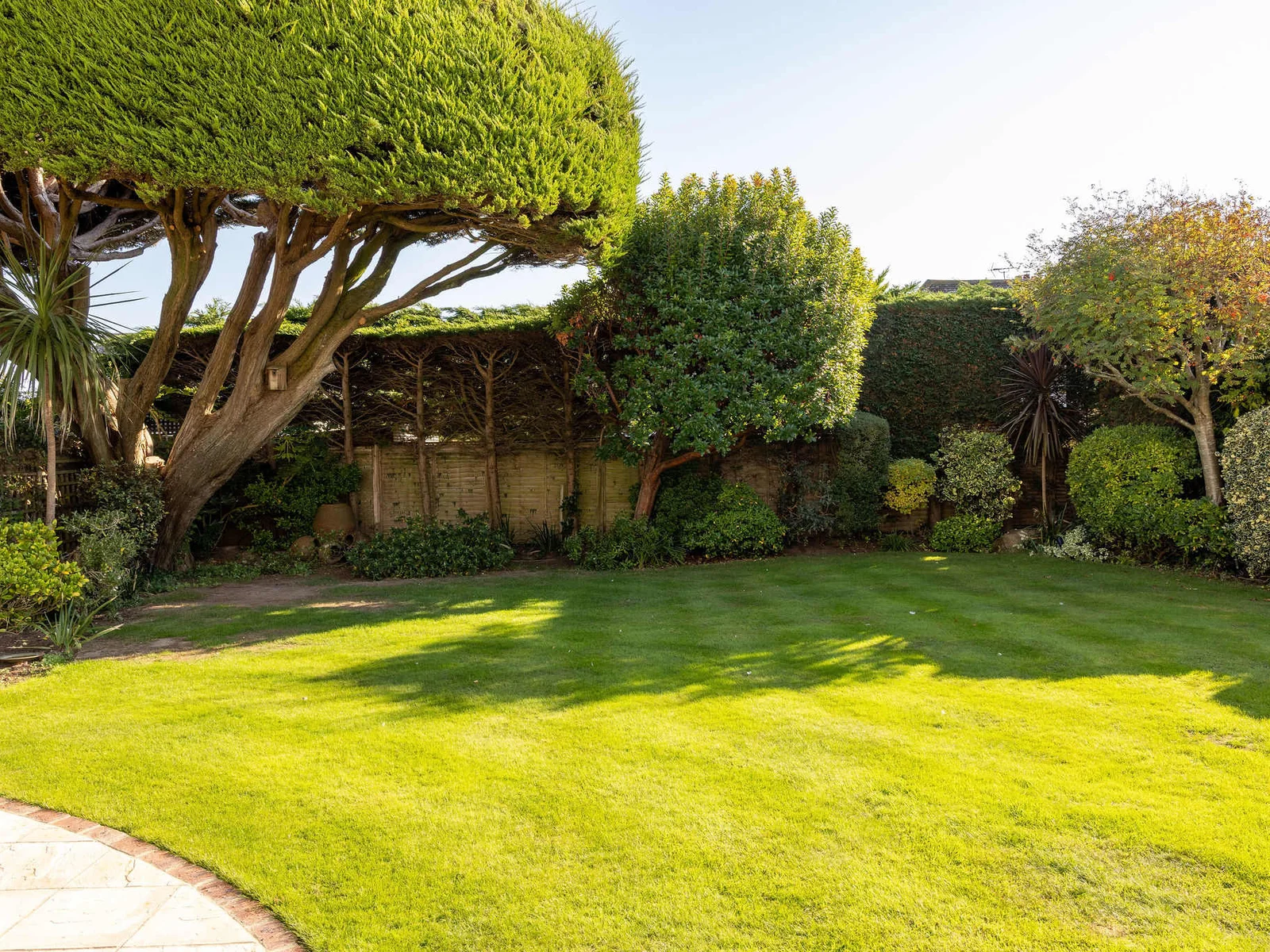The garden has a large lawned area which children will love to play on.