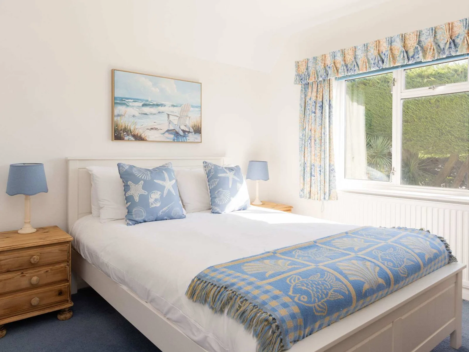 Bedroom 2 has a king size bed with quality linens, cushions and throws.
