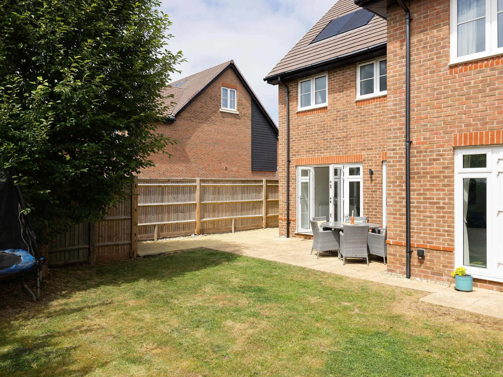 Our fully fenced garden. A safe and private space for children to play on the lawn.