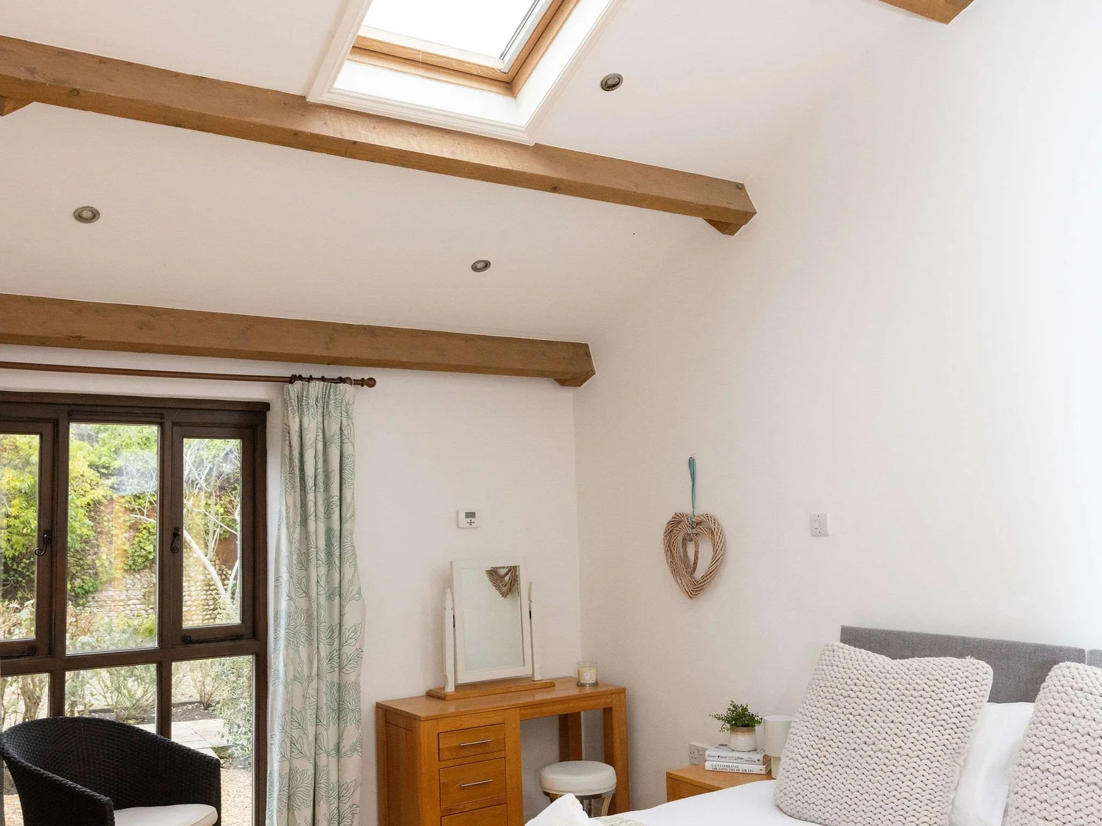 Vaulted ceilings and skylights give space and light to the room.