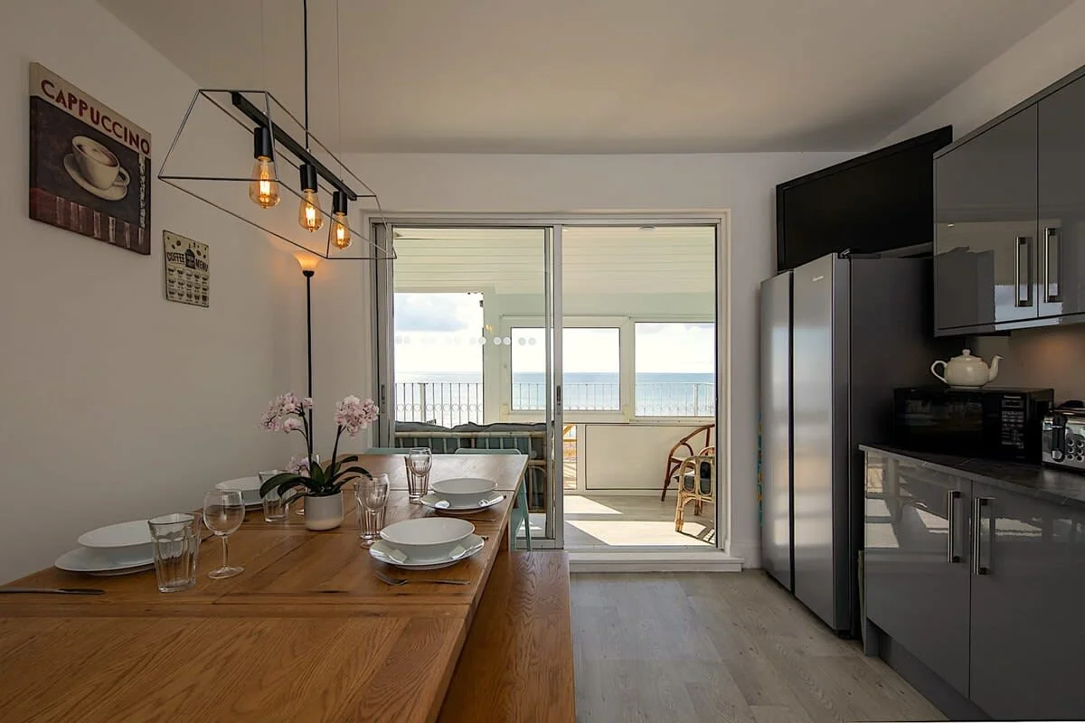 Welcome to your next home away from home right on the promenade (the top two levels only with the ground floor a separate apartment which is also available to book)