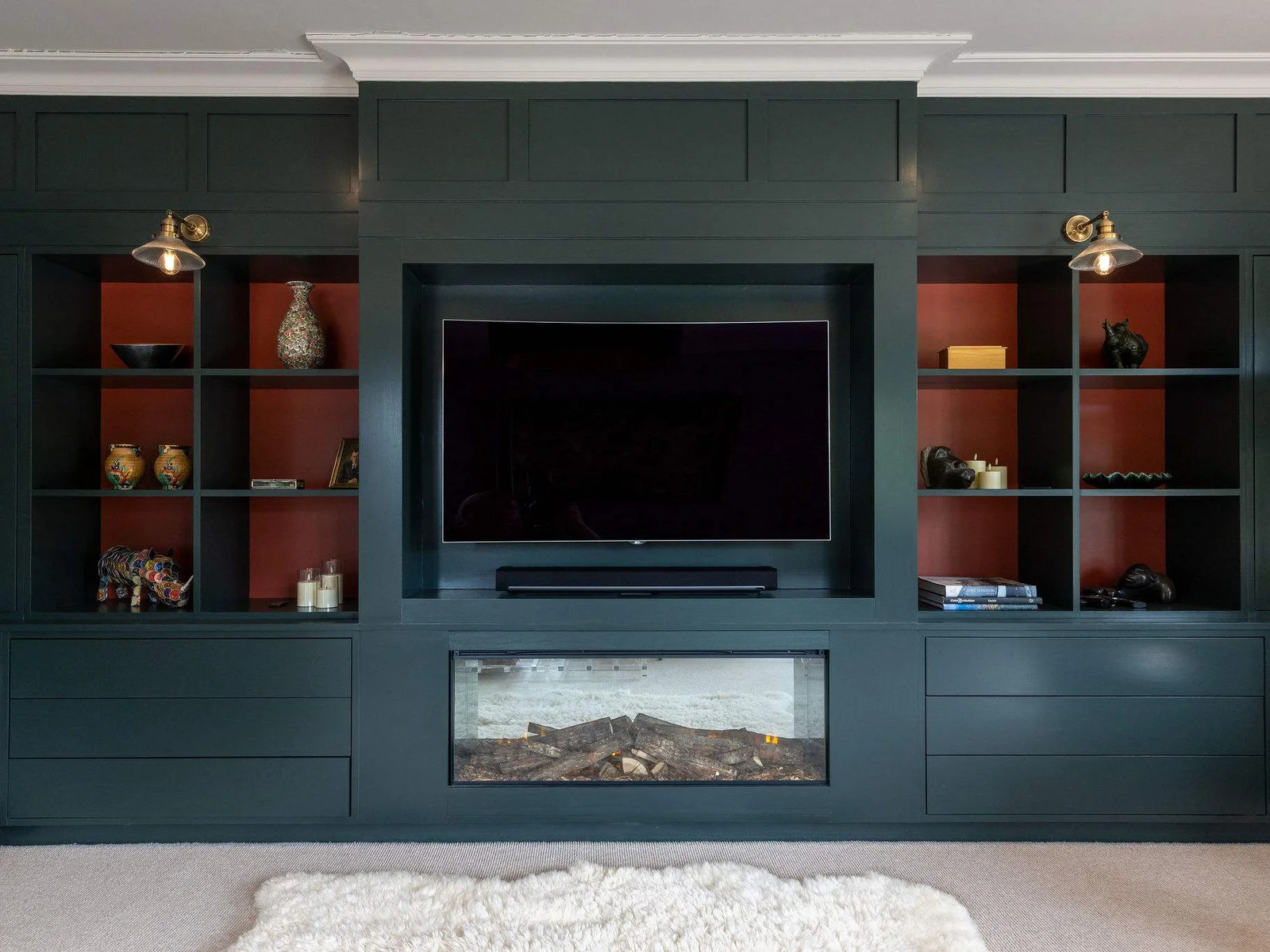 Cosy up in the lounge with a built-in media wall, electric fire, and curated art and décor