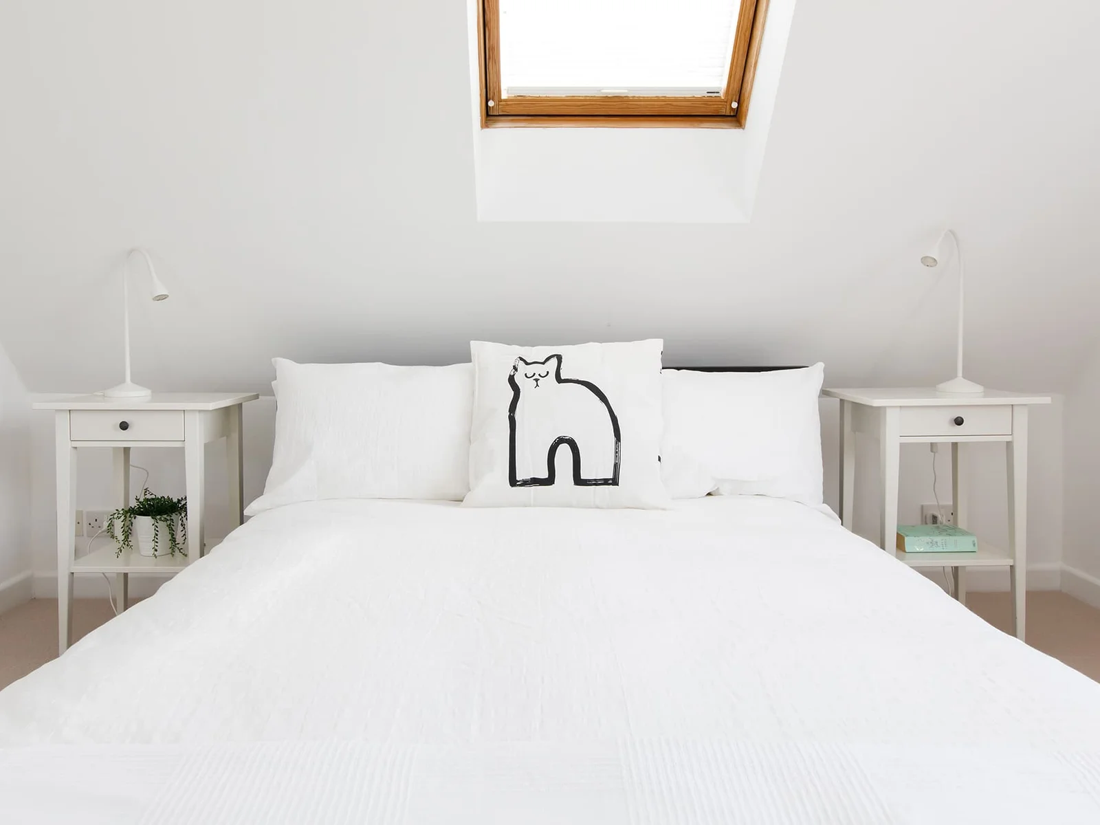 A further double room, with Velux windows, bedside tables and luxury bed linen.