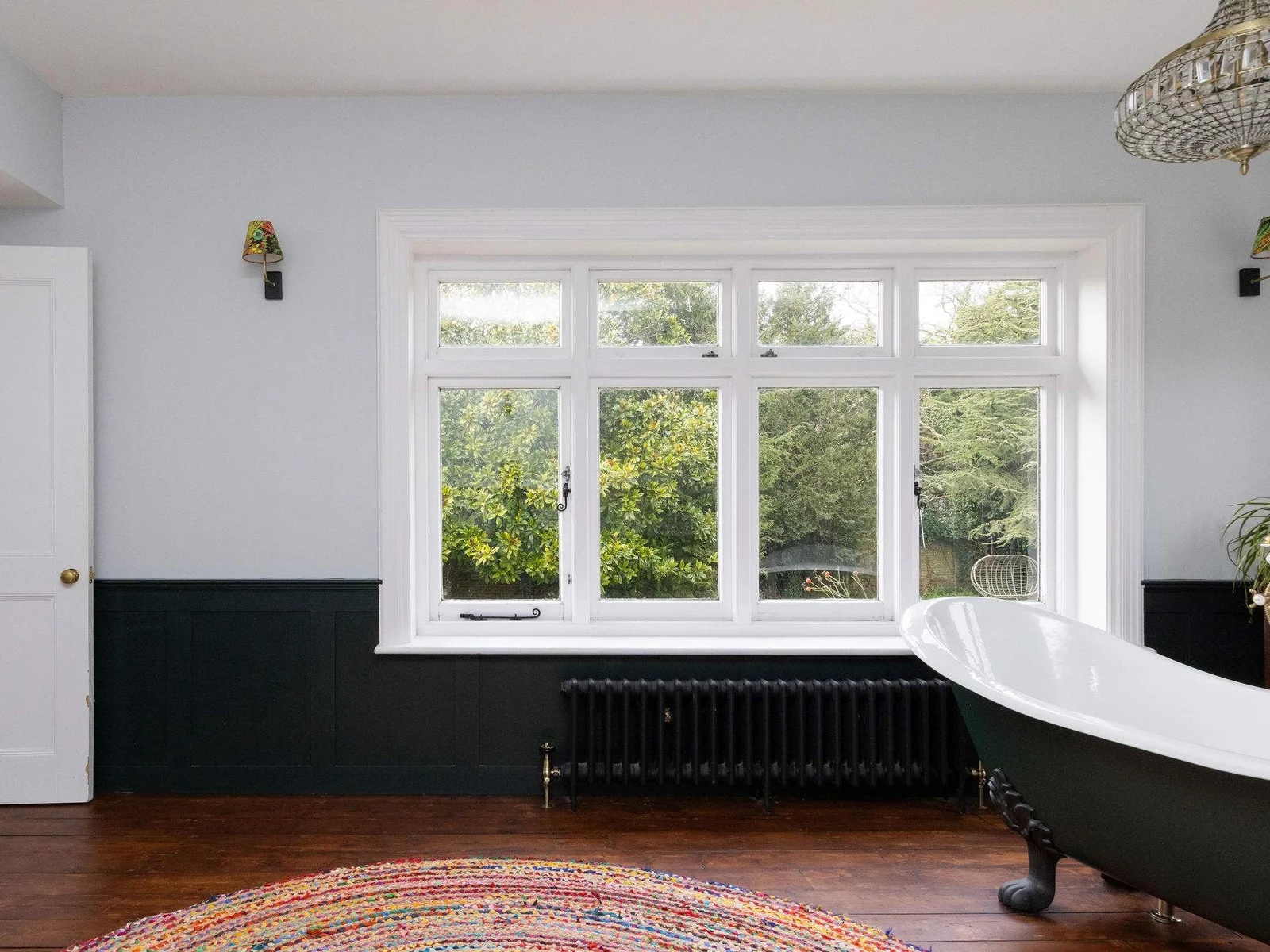 A grand window fills the space with natural light
