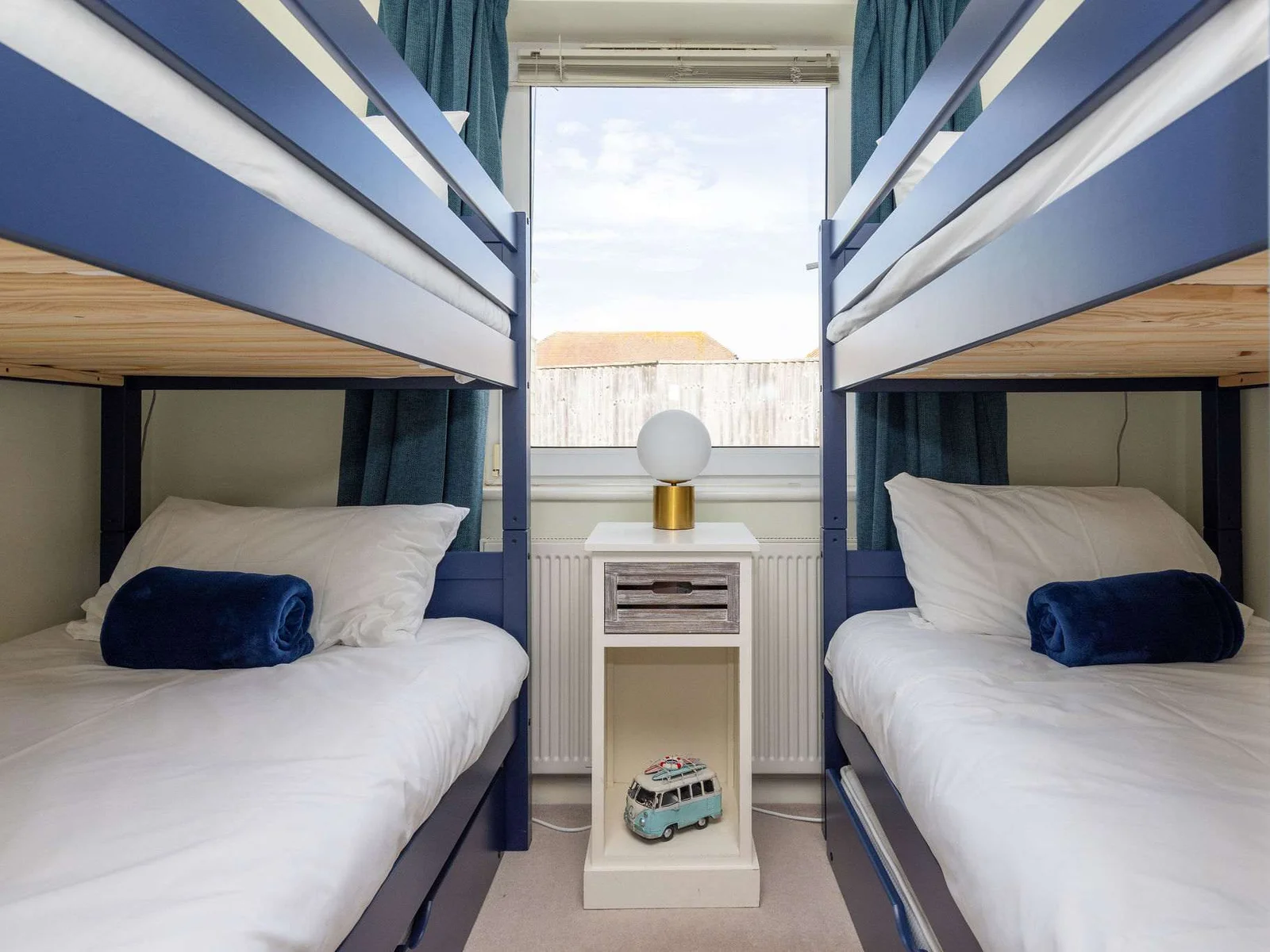 Bright and cosy room with two sets of bunk beds, ideal for kids or friends